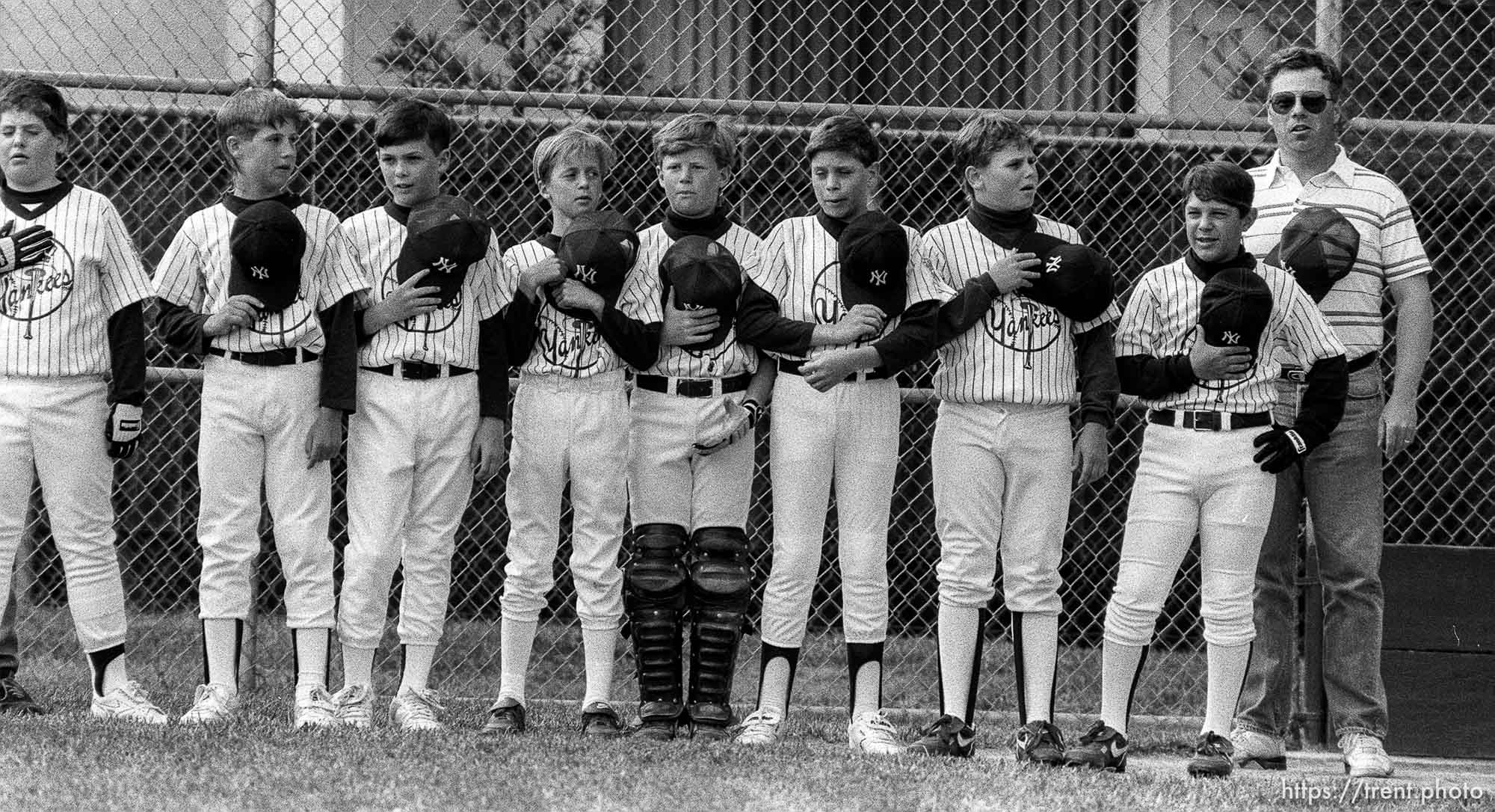 Players during national anthem at Yankees game.