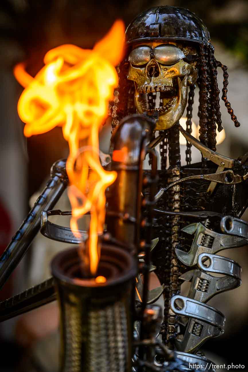 (Trent Nelson | The Salt Lake Tribune)
A skeletal saxophone-playing sculpture by Fred Conlon gets flaming hot at the Utah Arts Festival in Salt Lake City, Thursday June 21, 2018.