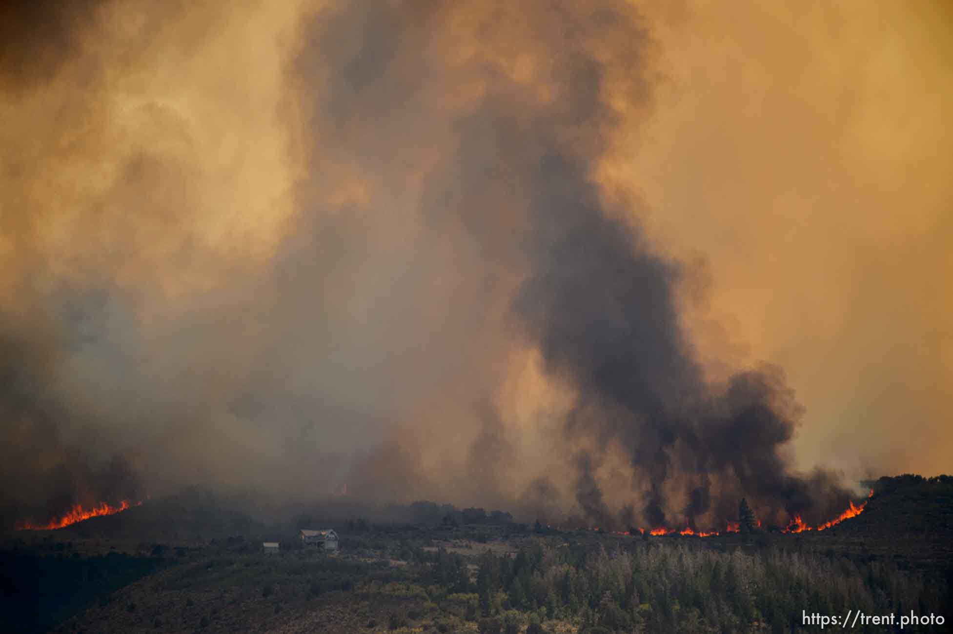 (Trent Nelson | The Salt Lake Tribune)
The Dollar Ridge Fire threatens a structure, as seen from Fruitland in Duchesne County, Tuesday July 3, 2018.