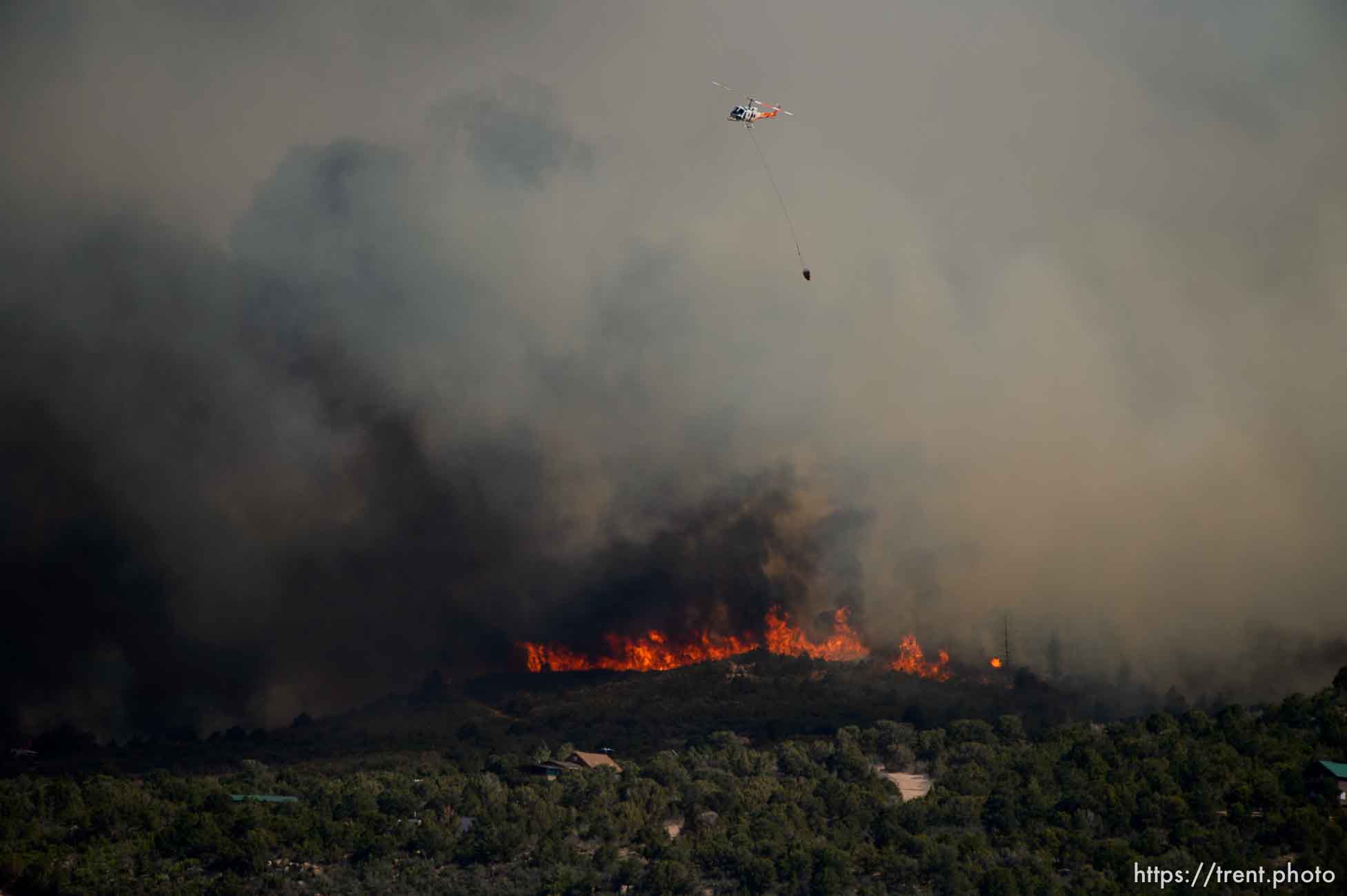 (Trent Nelson | The Salt Lake Tribune)
Helicopters make drops on the Dollar Ridge Fire near Fruitland in Duchesne County, Tuesday July 3, 2018.