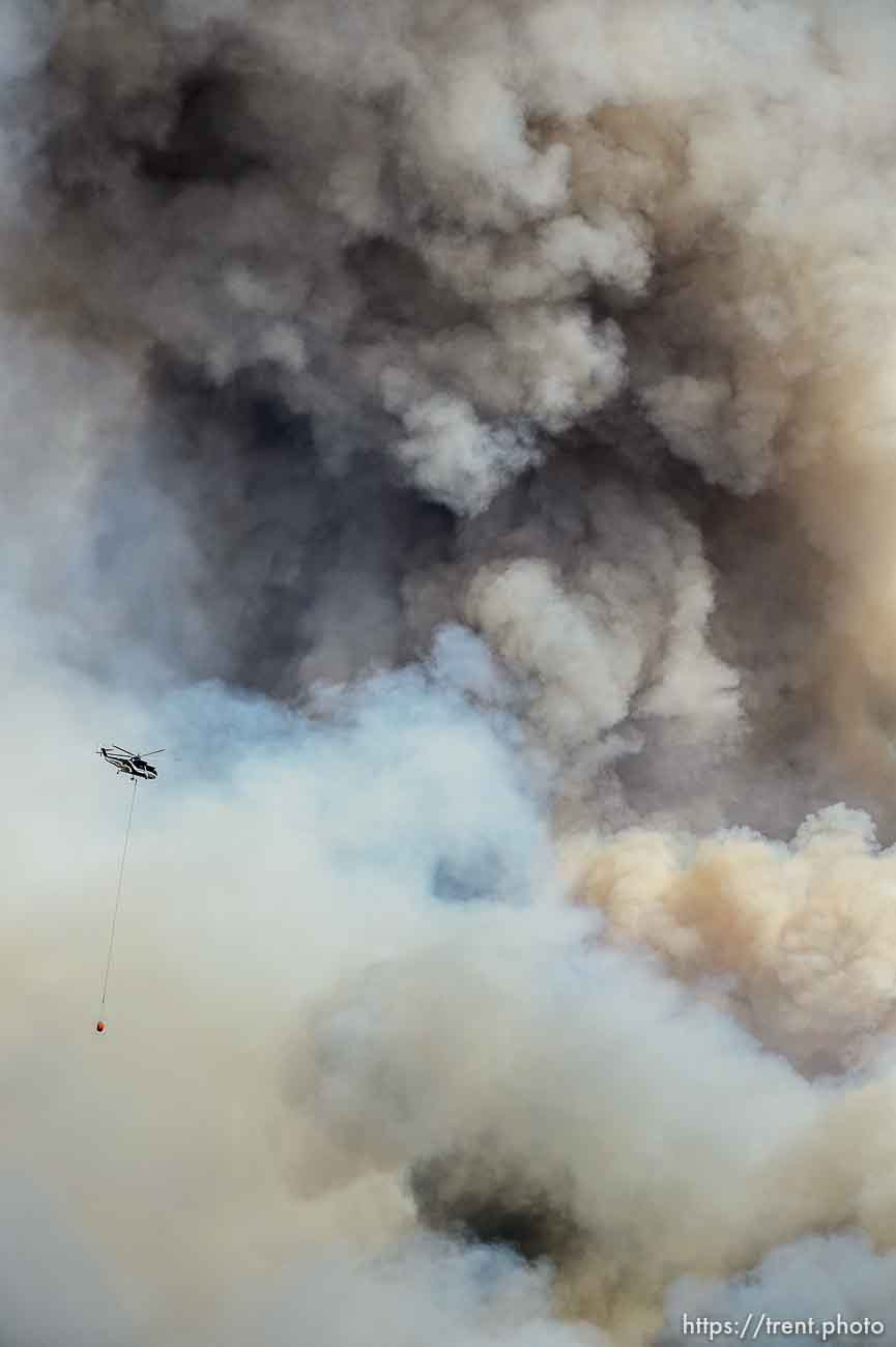 (Trent Nelson | The Salt Lake Tribune)  
Helicopters and tankers fight the Dollar Ridge Fire at Strawberry Reservoir, Friday July 6, 2018.