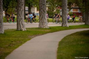 (Trent Nelson | The Salt Lake Tribune)
Cyclists gather and ride around Salt Lake City's Liberty Park, Saturday July 21, 2018, in remembrance of Cameron Hooyer, a rider who was killed by a FrontRunner train during a 999 Ride on Thursday.