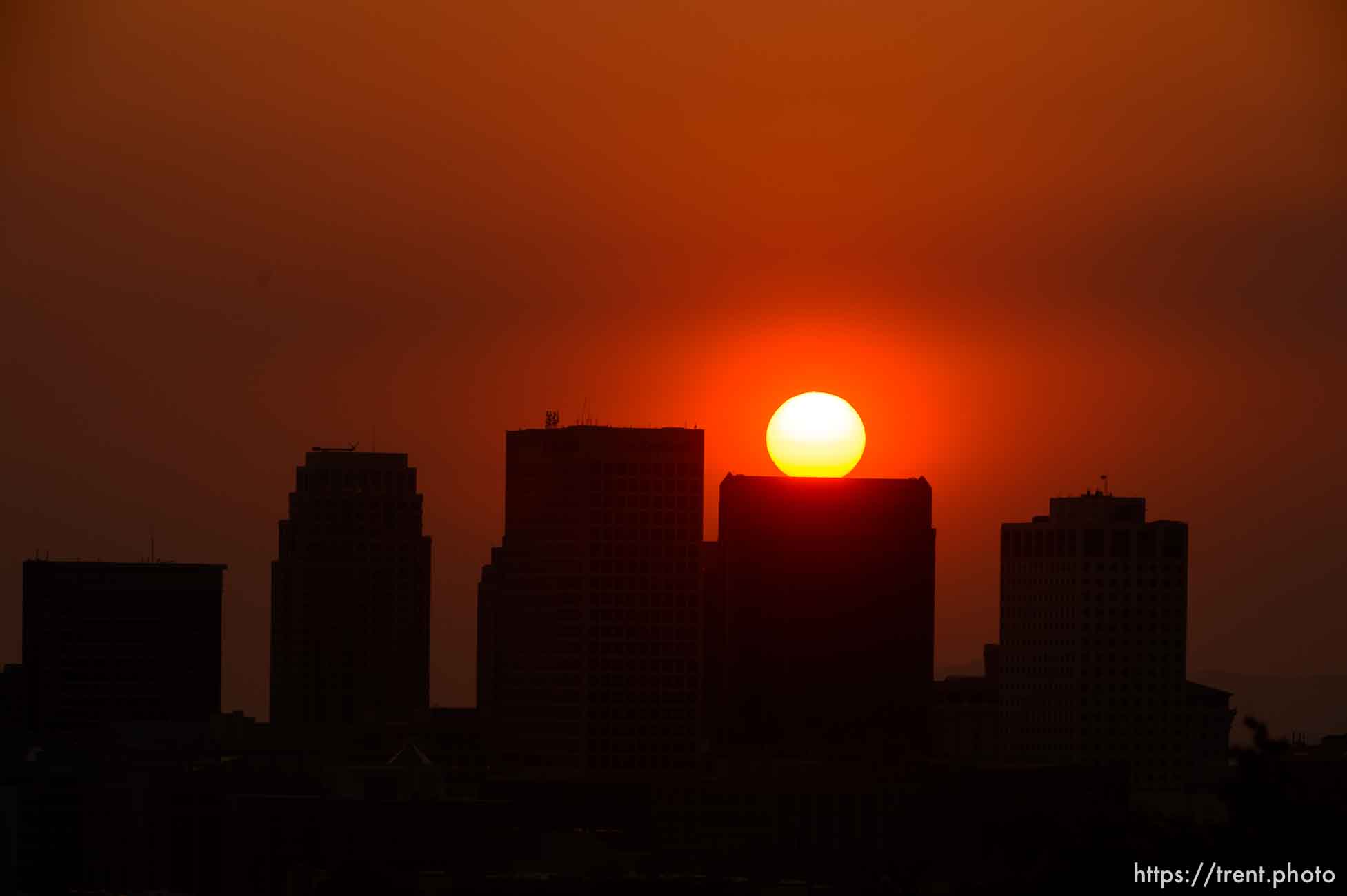 (Trent Nelson | The Salt Lake Tribune)
The sun sets over a hazy Salt Lake City, Monday Aug. 6, 2018.