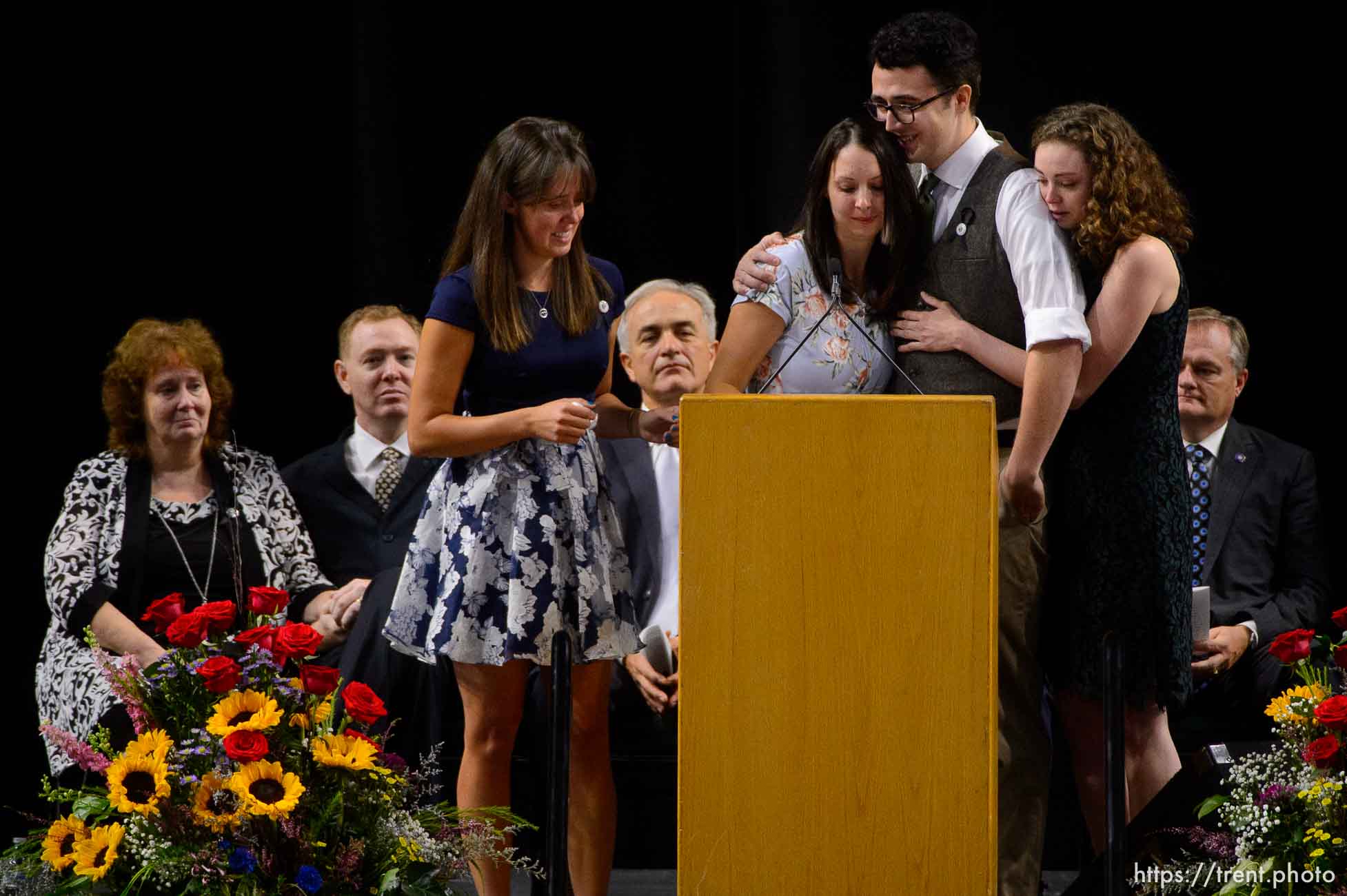 (Trent Nelson | The Salt Lake Tribune)  
Jill Robinson's children, Katie Merrill, Jessica Knorr, Riley Merrill, and Halie Merril speak at funeral services for Jill, a West Valley City code-enforcement officer killed on the job last week. The service took place at the Maverik Center in West Valley City on Friday Aug. 17, 2018.