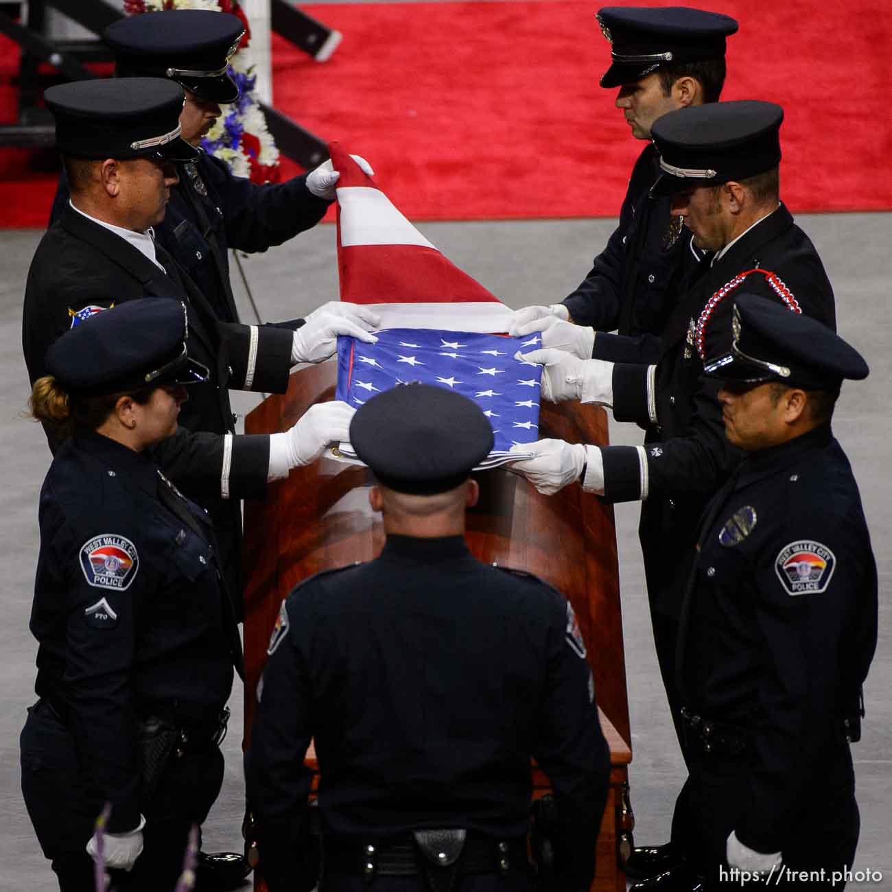 (Trent Nelson | The Salt Lake Tribune)  
West Valley City police officers perform a flag presentation for family members at funeral services for Jill Robinson, a West Valley City code-enforcement officer killed on the job last week. The service took place at the Maverik Center in West Valley City on Friday Aug. 17, 2018.