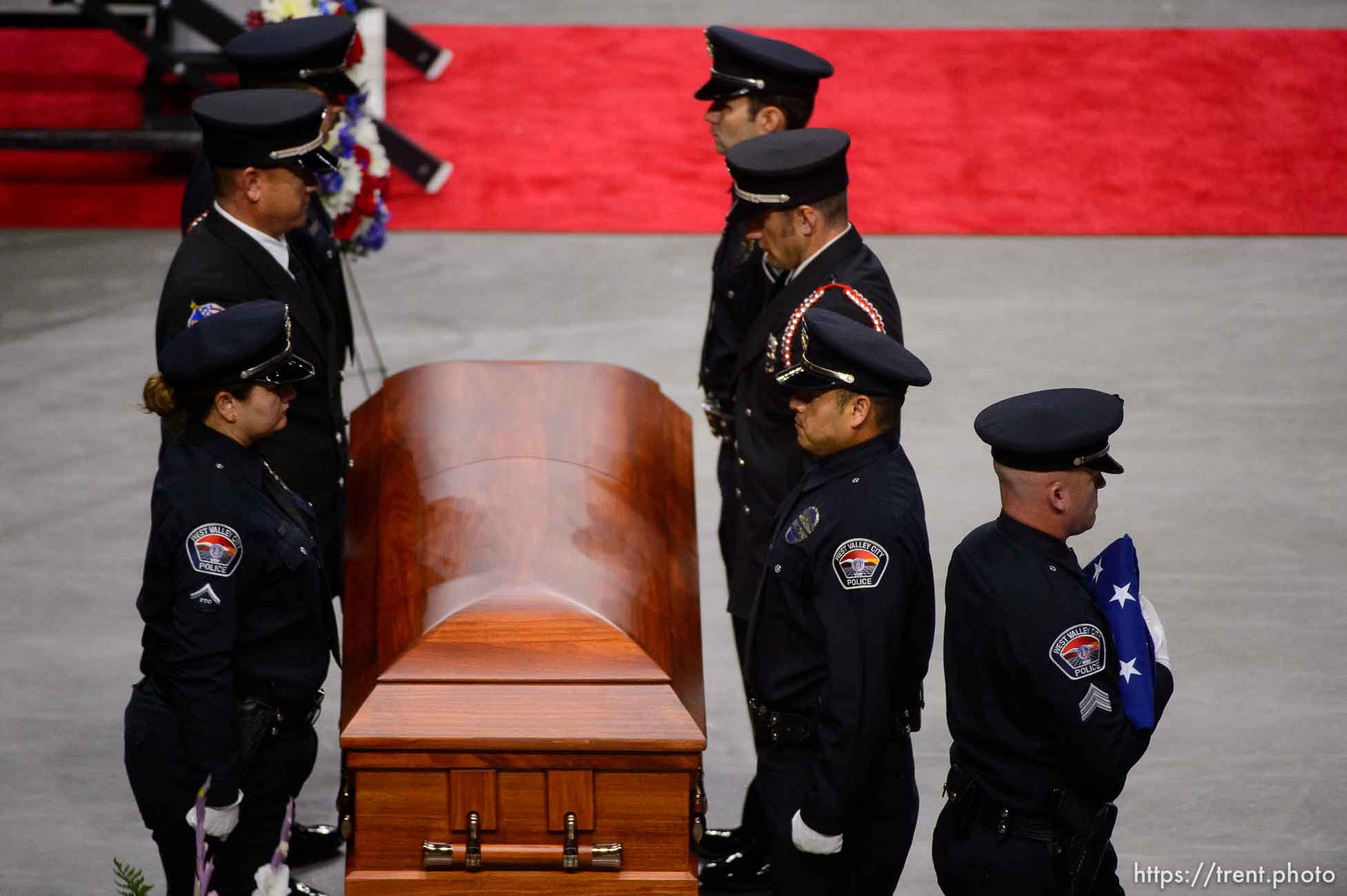 (Trent Nelson | The Salt Lake Tribune)  
West Valley City police officers perform a flag presentation for family members at funeral services for Jill Robinson, a West Valley City code-enforcement officer killed on the job last week. The service took place at the Maverik Center in West Valley City on Friday Aug. 17, 2018.