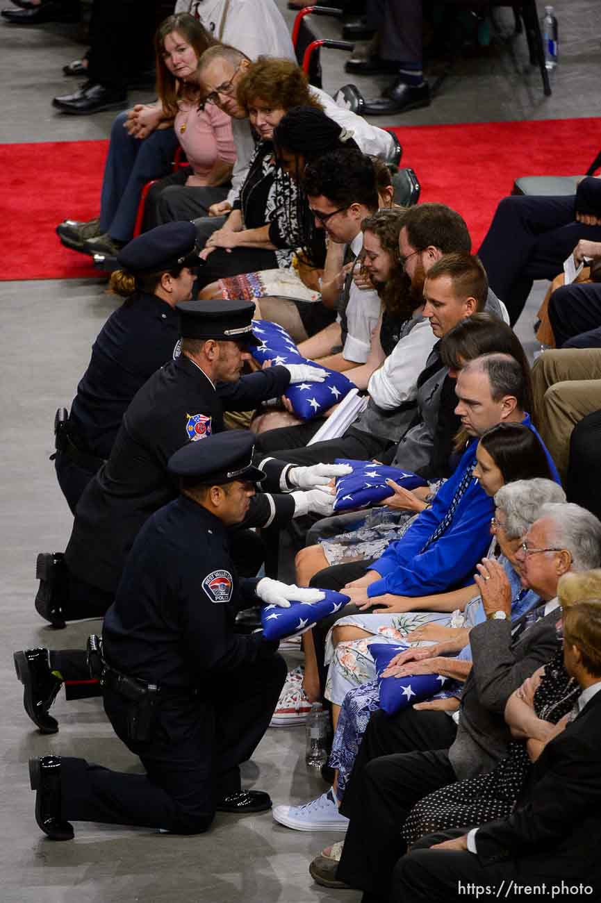 (Trent Nelson | The Salt Lake Tribune)  
West Valley City police officers perform a flag presentation for family members at funeral services for Jill Robinson, a West Valley City code-enforcement officer killed on the job last week. The service took place at the Maverik Center in West Valley City on Friday Aug. 17, 2018.