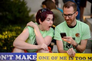 (Trent Nelson | The Salt Lake Tribune)  
Michelle and Steve Boyer watch Sam Young speak on a livestream after his hearing. People gathered in front of the LDS Church Administration Building Salt Lake City, Sunday Sept. 9, 2018 in support of Sam Young. Young was in a disciplinary hearing tonight after he made calls for changes to the church's youth interview process.