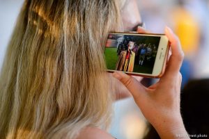 (Trent Nelson | The Salt Lake Tribune)  
A woman listens as Sam Young speaks on a livestream after his hearing. People gathered in front of the LDS Church Administration Building Salt Lake City, Sunday Sept. 9, 2018 in support of Sam Young. Young was in a disciplinary hearing tonight after he made calls for changes to the church's youth interview process.