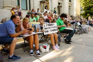 (Trent Nelson | The Salt Lake Tribune)  
People watch as Sam Young speaks on a livestream after his hearing. People gathered in front of the LDS Church Administration Building Salt Lake City, Sunday Sept. 9, 2018 in support of Sam Young. Young was in a disciplinary hearing tonight after he made calls for changes to the church's youth interview process.