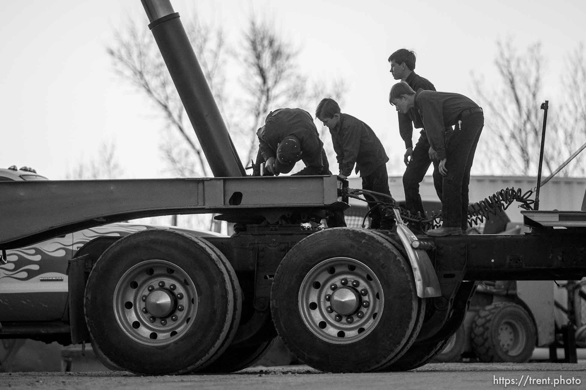 Trent Nelson  |  The Salt Lake Tribune
man and boys working on truck, Thursday February 25, 2016.