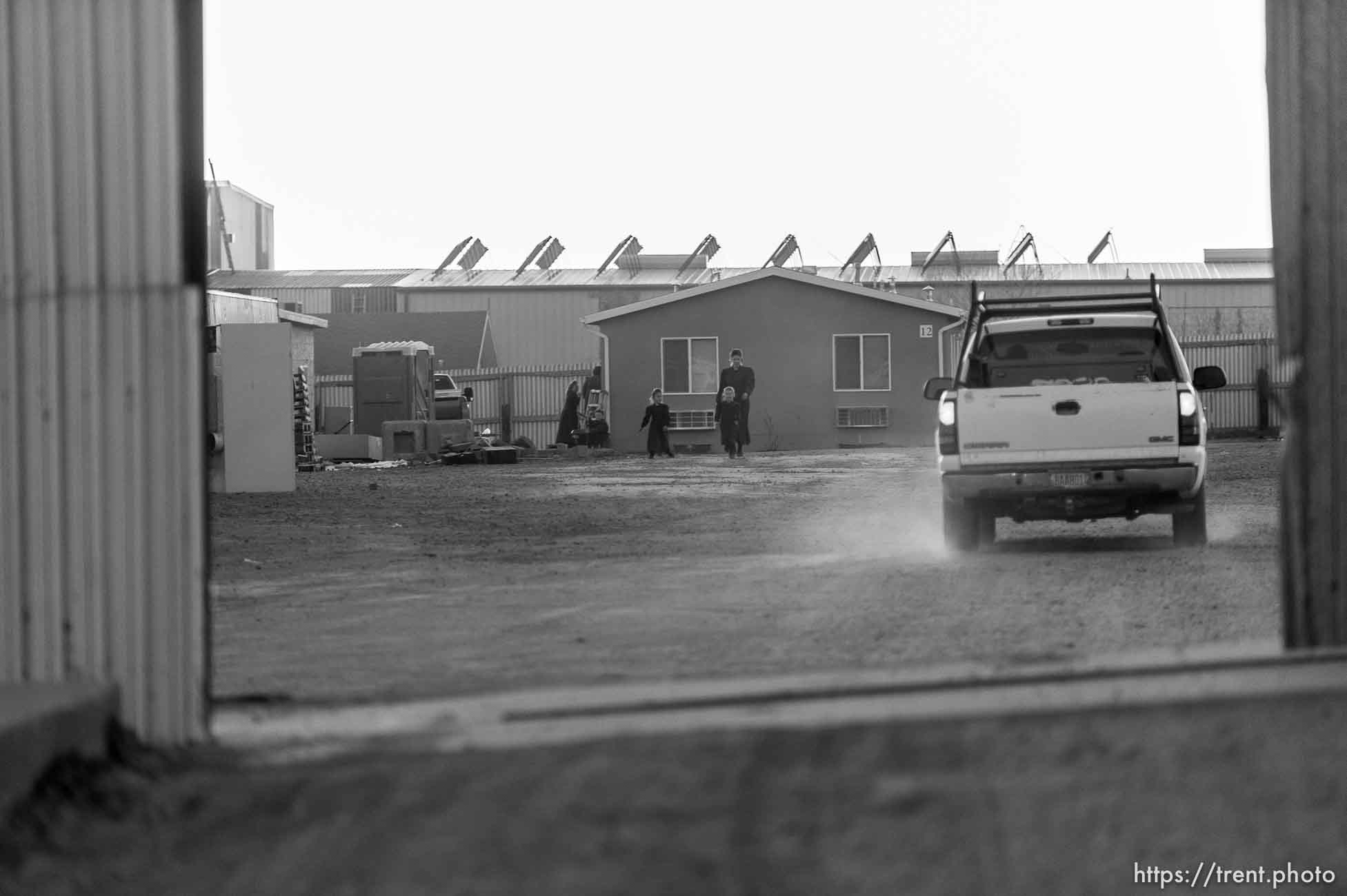 Trent Nelson  |  The Salt Lake Tribune
Women and children seen through a closing security gate at the FLDS bishop's storehouse in Colorado City, Thursday February 25, 2016.