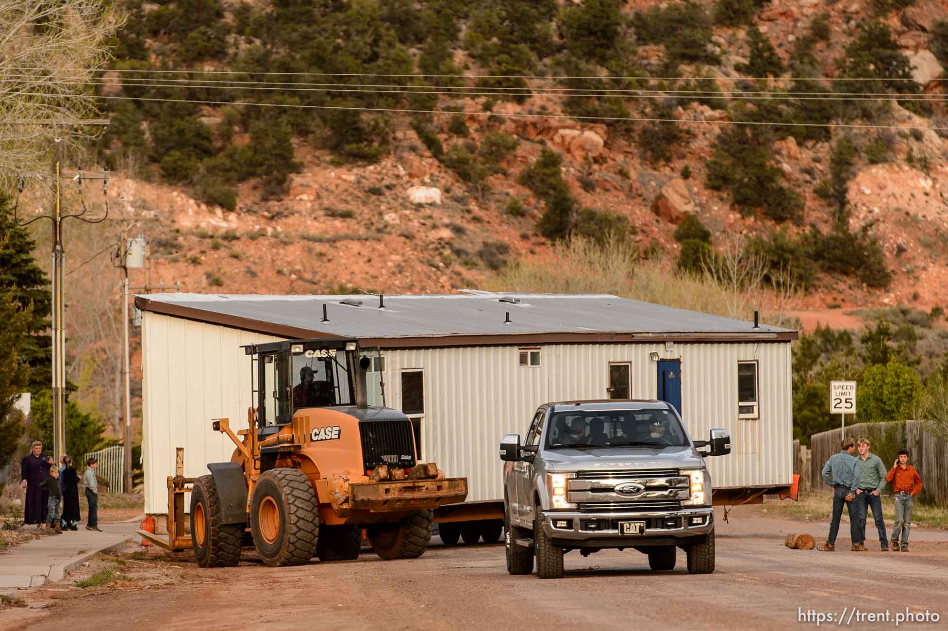 Trent Nelson  |  The Salt Lake Tribune
A group of FLDS members move a modular home from a lot in Hildale as part of an eviction from UEP trust property, Wednesday April 5, 2017. Many FLDS members have refused to cooperate with the state-controlled land trust and are now facing eviction.