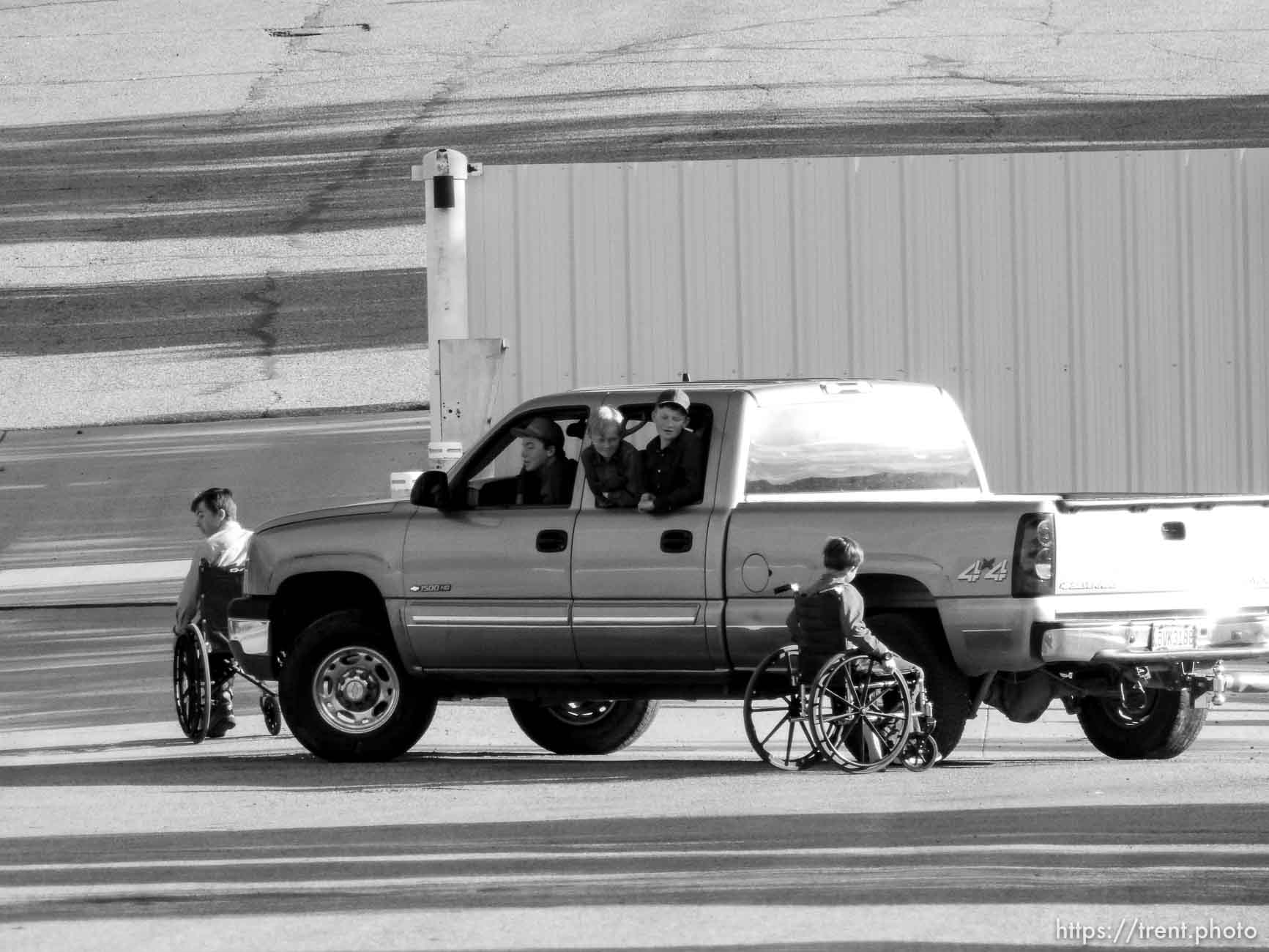 Trent Nelson  |  The Salt Lake Tribune
flds boys play on wheelchairs as hildale clinic appears to be moved out of, Monday May 8, 2017.