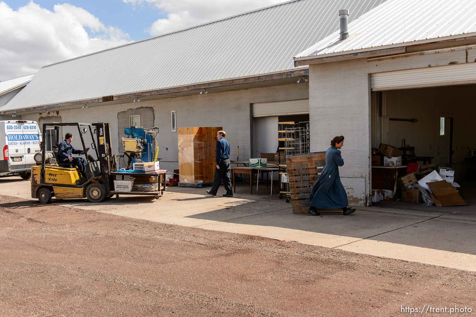 Trent Nelson  |  The Salt Lake Tribune
FLDS members scramble to remove equipment from what had been the FLDS food storehouse in Colorado City, AZ, as the UEP Trust evicts them from the property, Monday May 8, 2017.