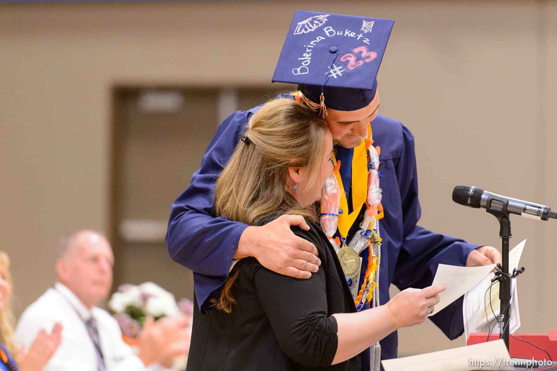 Trent Nelson  |  The Salt Lake Tribune
shirlee draper presents uep trust scholarship to roy jessop at Water Canyon High School's graduation ceremony in Hildale, Monday May 22, 2017. Two years ago the school had one graduate, this year twenty-five.