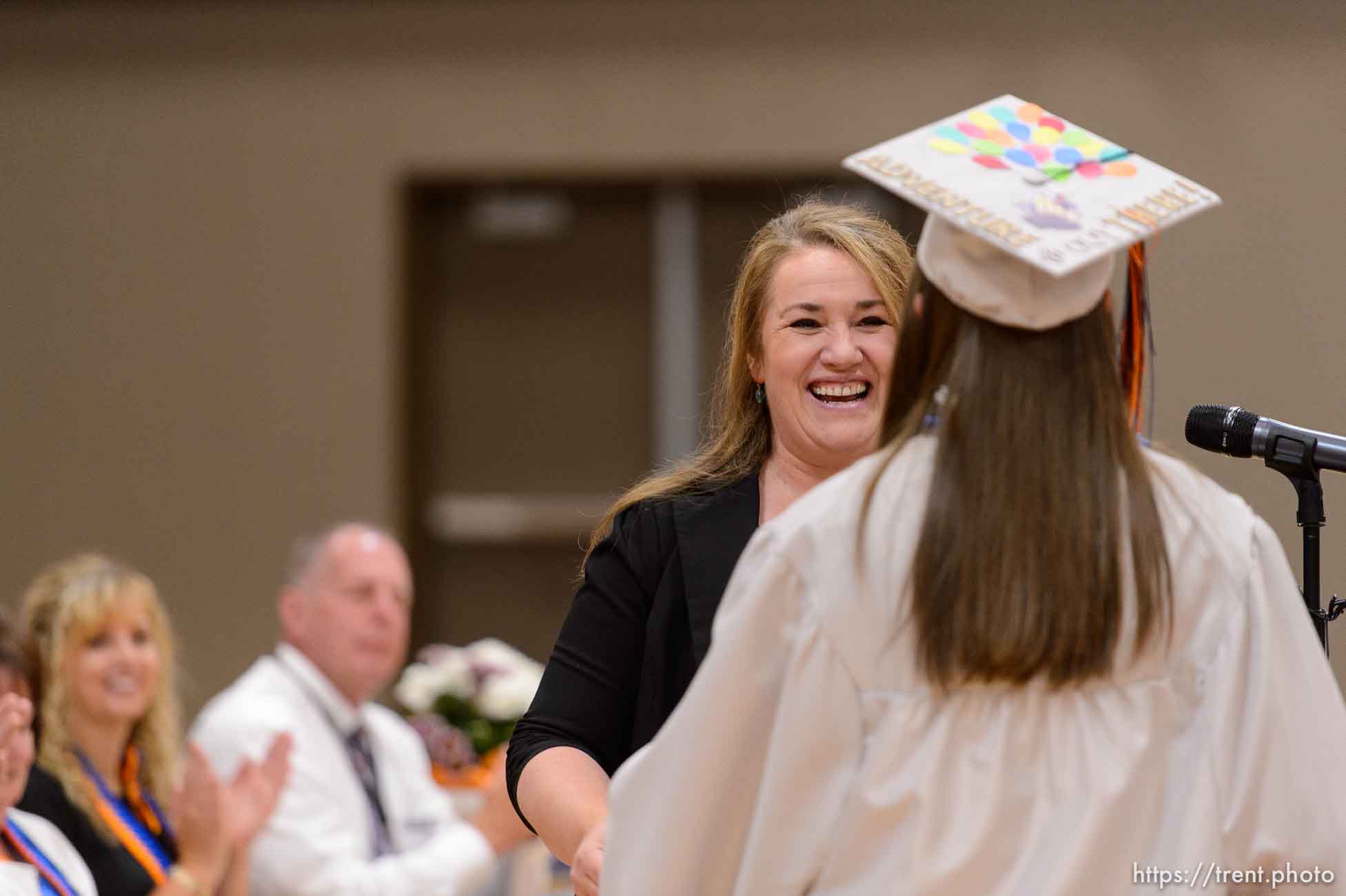 Trent Nelson  |  The Salt Lake Tribune
shirlee draper presents uep trust scholarship to amy barlow at Water Canyon High School's graduation ceremony in Hildale, Monday May 22, 2017. Two years ago the school had one graduate, this year twenty-five.