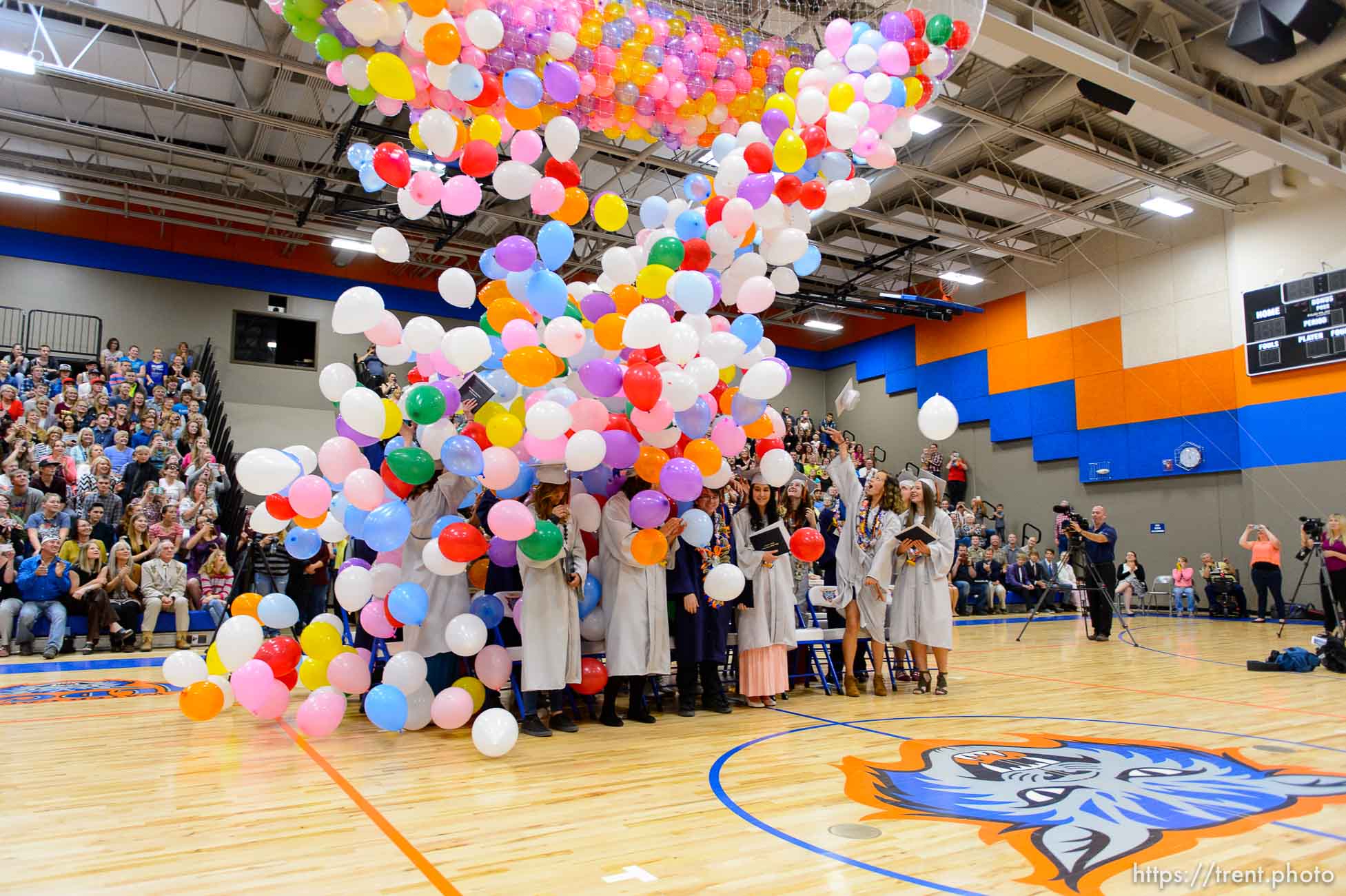 Trent Nelson  |  The Salt Lake Tribune
Balloons fall on graduates at Water Canyon High School's graduation ceremony in Hildale, Monday May 22, 2017. Two years ago the school had one graduate, this year twenty-five.