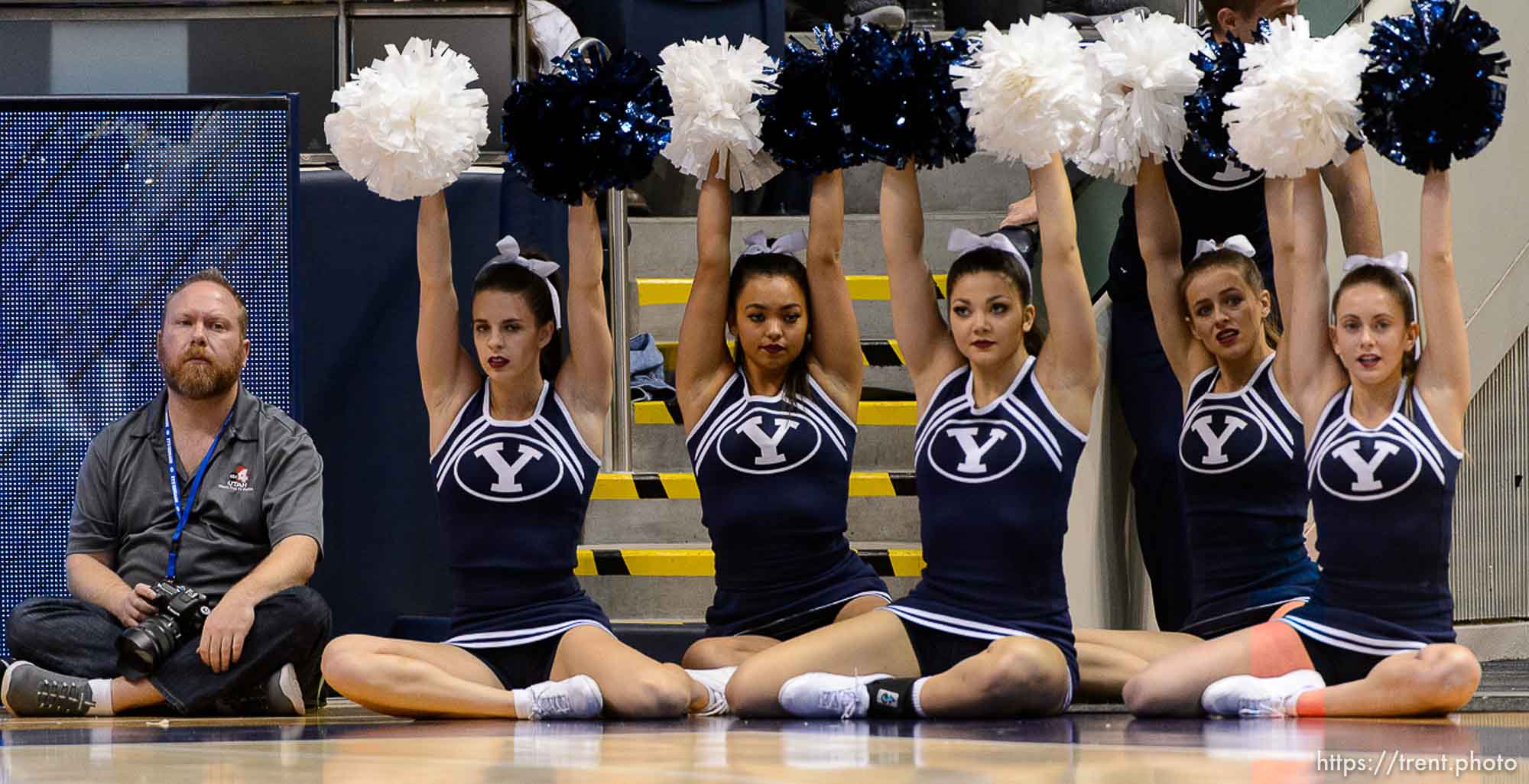 (Trent Nelson | The Salt Lake Tribune)  cheerleaders and photographer as BYU hosts Utah, NCAA women's basketball in Provo, Saturday December 9, 2017.