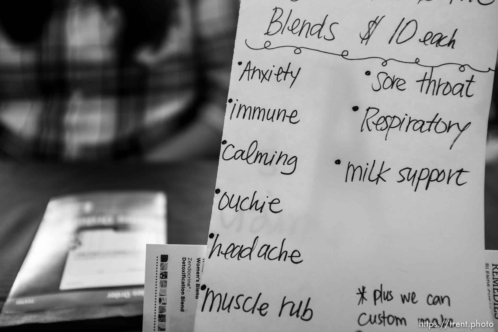 A sign shows various ailments Liz and Karen Dutson offer oil blends for at a Christmas Market in Colorado City, Ariz., Saturday December 16, 2017.