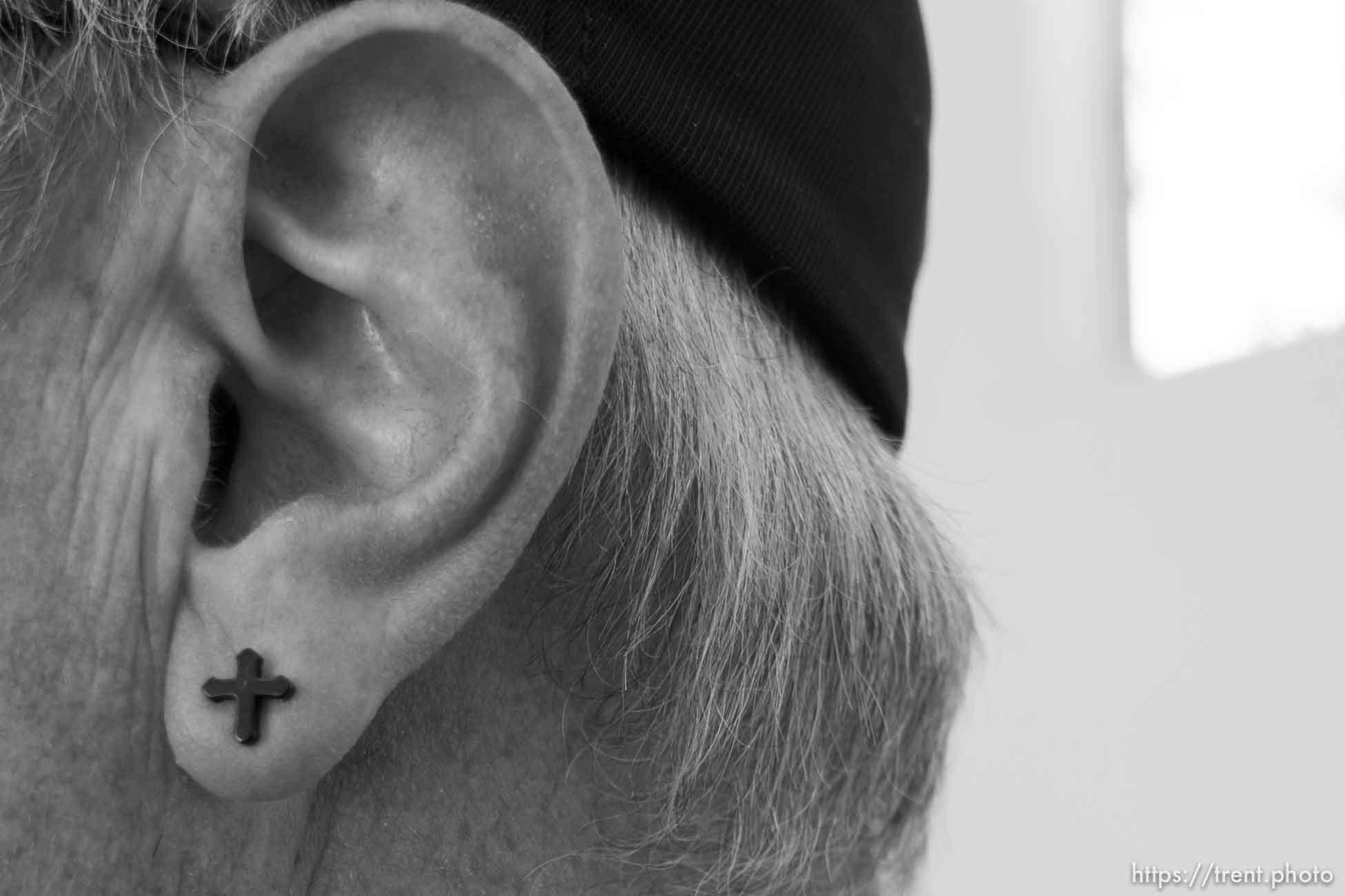 Trent Nelson  |  The Salt Lake Tribune
A religious earring on Scott Carey, a volunteer at the Short Creek Family Services Center, which provides food and services to families, Wednesday September 14, 2016.