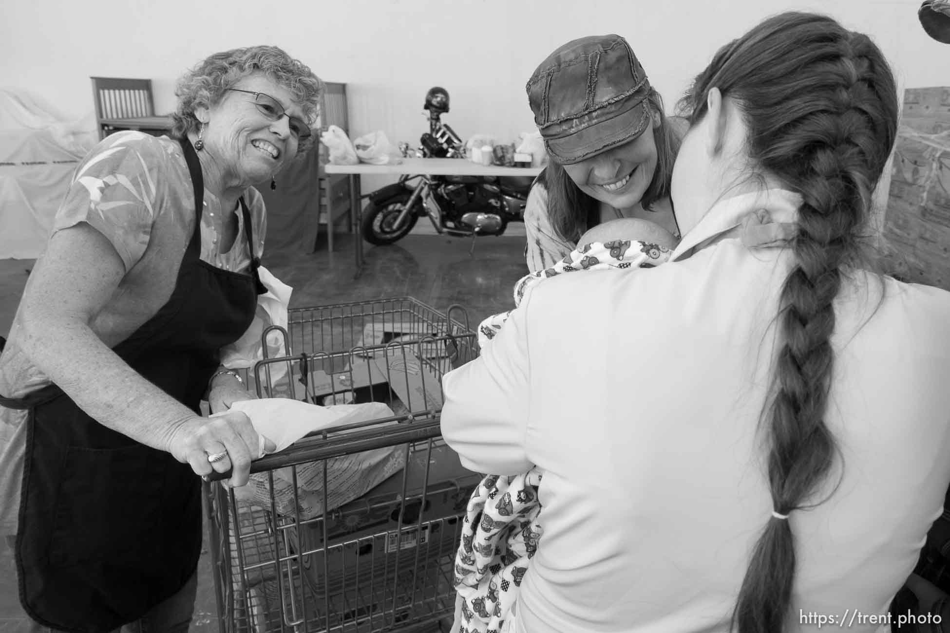 Trent Nelson  |  The Salt Lake Tribune
Volunteers Sharon Collins and Tammy Barlow smile at clients at the Short Creek Family Services Center, which provides food and services to families, Wednesday September 14, 2016.