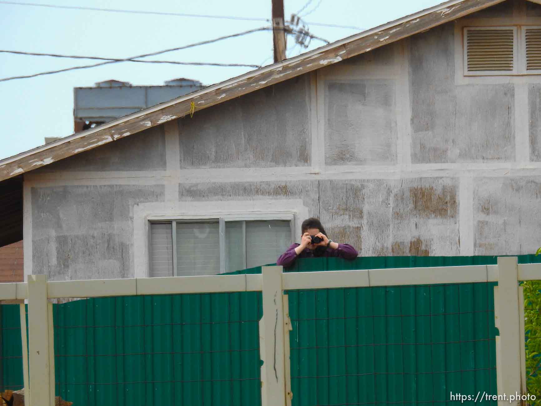 Trent Nelson  |  The Salt Lake Tribune
An FLDS girl photographs as the locks are changed on an empty home in Colorado City, AZ, Tuesday May 9, 2017.