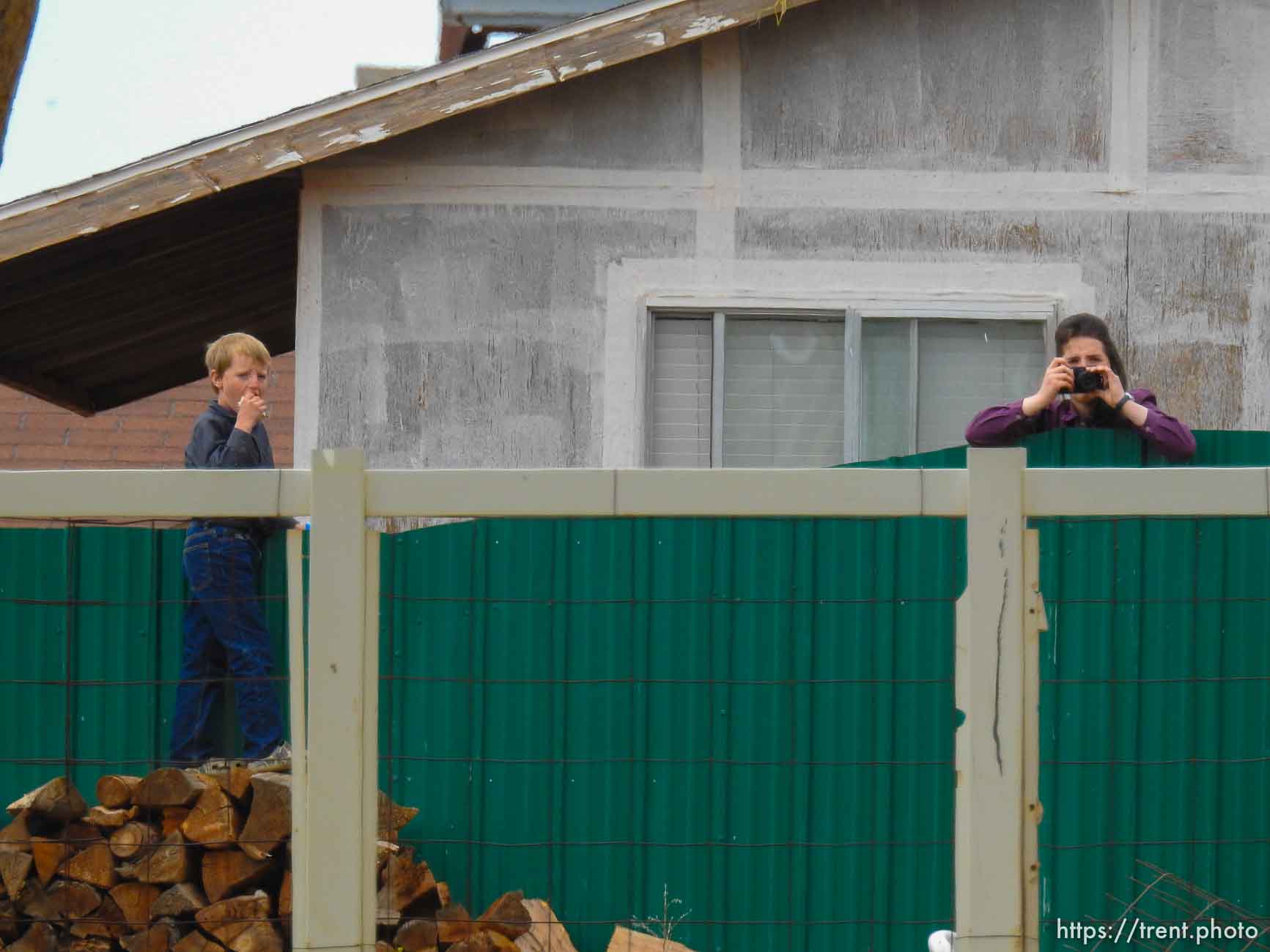 Trent Nelson  |  The Salt Lake Tribune
An FLDS girl photographs as the locks are changed on an empty home in Colorado City, AZ, Tuesday May 9, 2017.