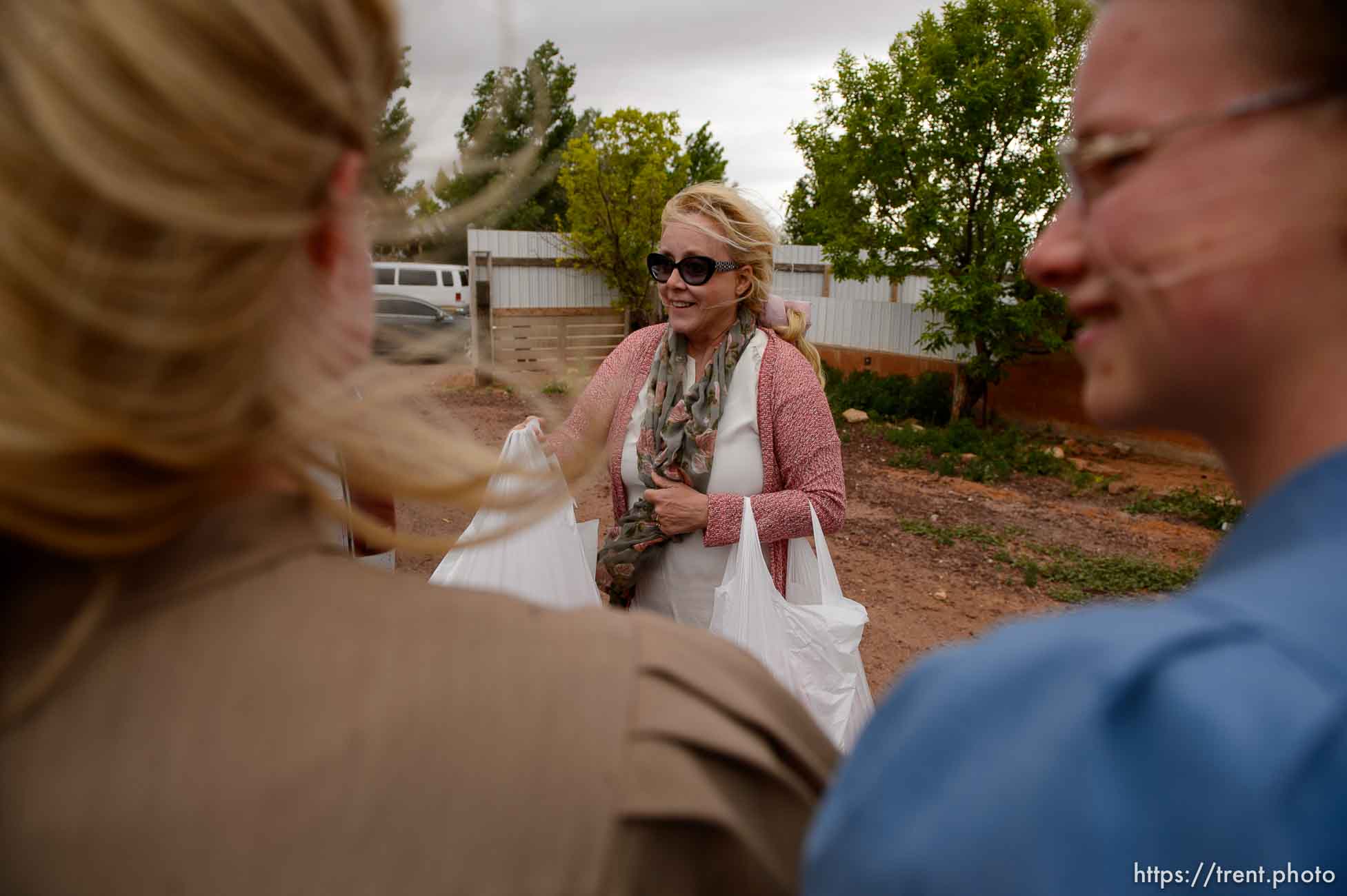 Trent Nelson  |  The Salt Lake Tribune
Christine Marie Katas hands out relief kits to FLDS women in Colorado City, AZ, Tuesday May 9, 2017, as the locks are changed on the home next door by the UEP Trust.