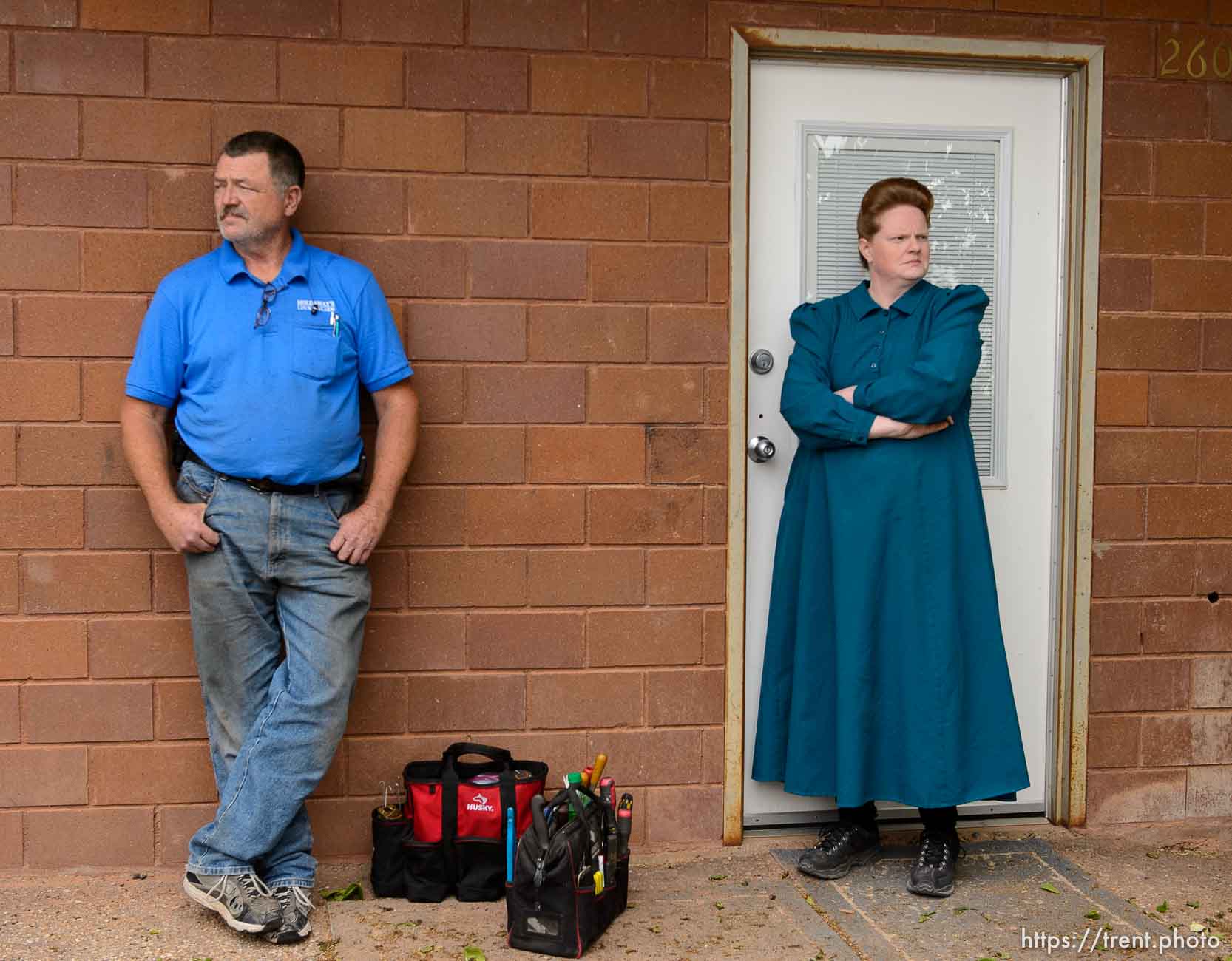 Trent Nelson  |  The Salt Lake Tribune
Locksmith Kelvin Holdaway and FLDS member Julia Johnson stand outisde of her Colorado City, AZ, property awaiting the outcome of a confrontation over her eviction, Tuesday May 9, 2017. Johnson was given more time to stay on the property before her eviction.