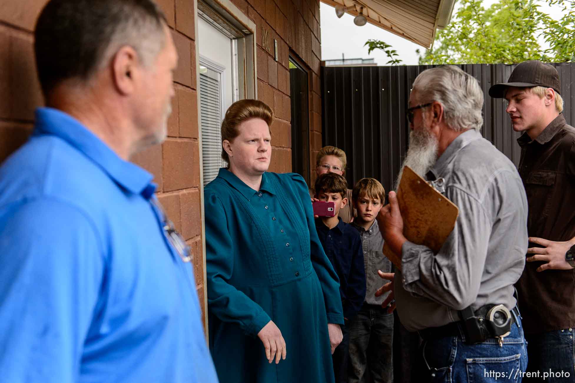 Trent Nelson  |  The Salt Lake Tribune
FLDS member Julia Johnson confronts Mohave County Constable Mike Hoggard, disputing the UEP Trust's ability to evict her from a property in Colorado City, AZ, Tuesday May 9, 2017. Locksmith Kelvin Holdaway in blue.