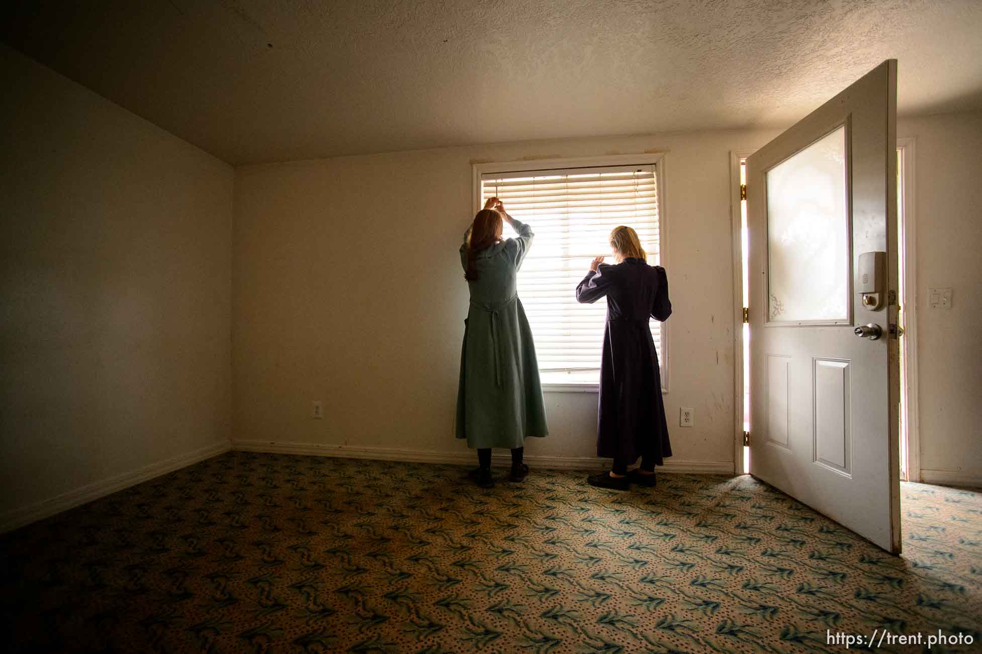 Trent Nelson  |  The Salt Lake TribuneFLDS children look on as a Colorado City, AZ, home across the street has its locks changed in an eviction by the UEP Trust, Tuesday May 9, 2017.