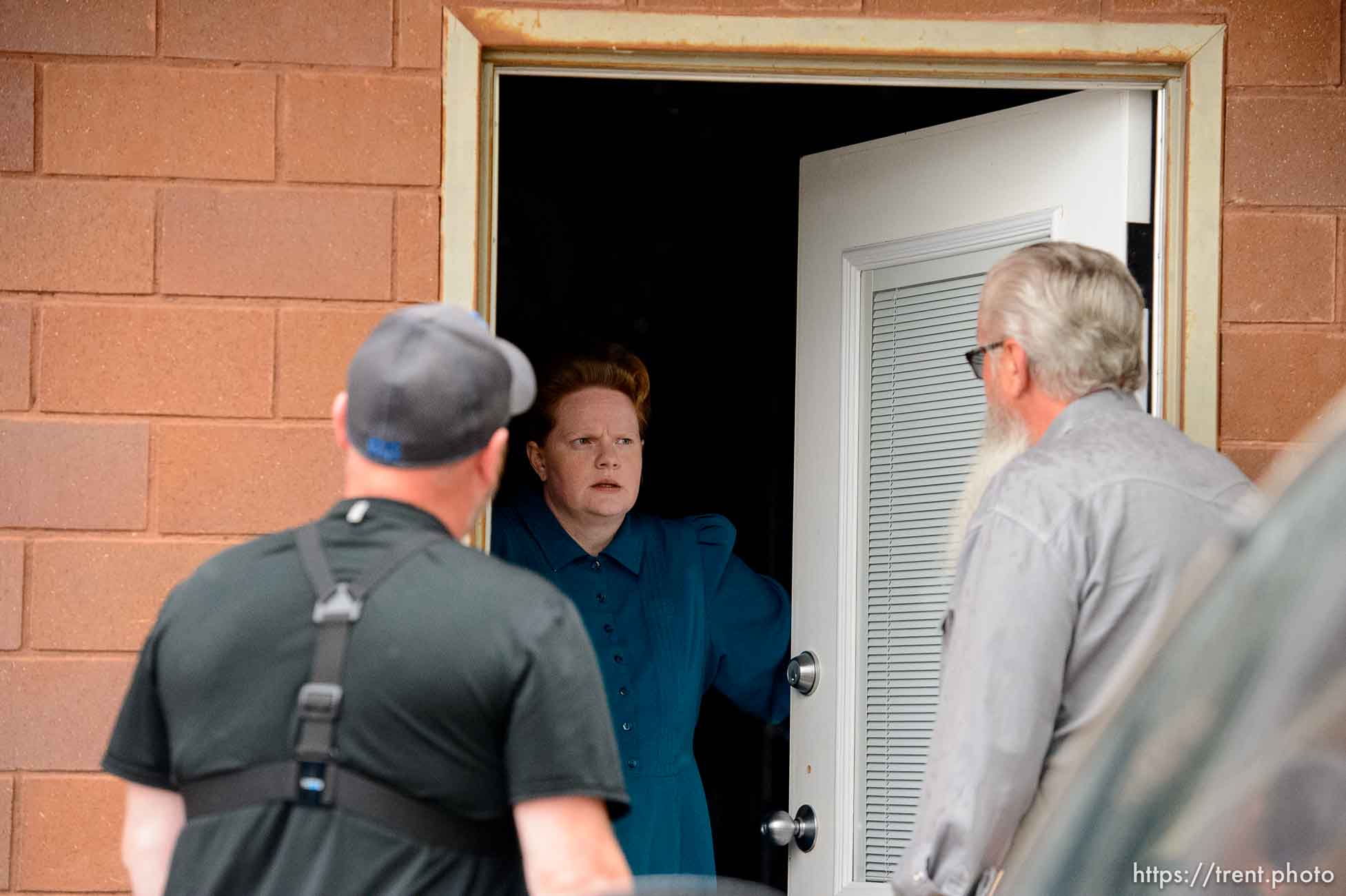 Trent Nelson  |  The Salt Lake Tribune
FLDS member Julia Johnson confronts Mohave County Constable Mike Hoggard, disputing the UEP Trust's ability to evict her from a property in Colorado City, AZ, Tuesday May 9, 2017. Ted Barlow at left.