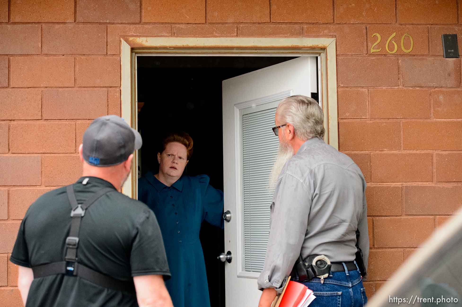 Trent Nelson  |  The Salt Lake Tribune
FLDS member Julia Johnson confronts Mohave County Constable Mike Hoggard, disputing the UEP Trust's ability to evict her from a property in Colorado City, AZ, Tuesday May 9, 2017. Ted Barlow at left.