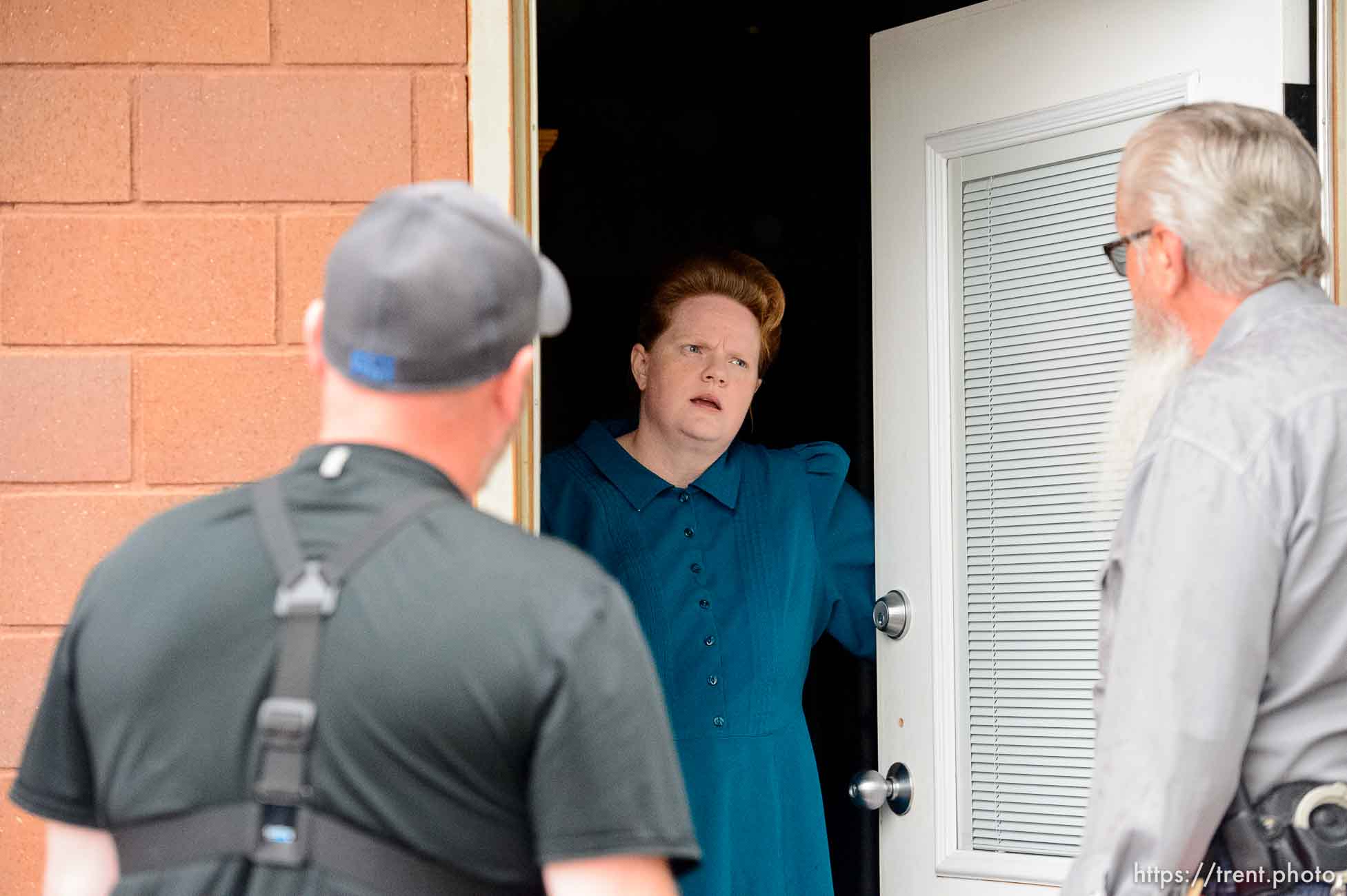 Trent Nelson  |  The Salt Lake Tribune
FLDS member Julia Johnson confronts Mohave County Constable Mike Hoggard, disputing the UEP Trust's ability to evict her from a property in Colorado City, AZ, Tuesday May 9, 2017. Ted Barlow at left.