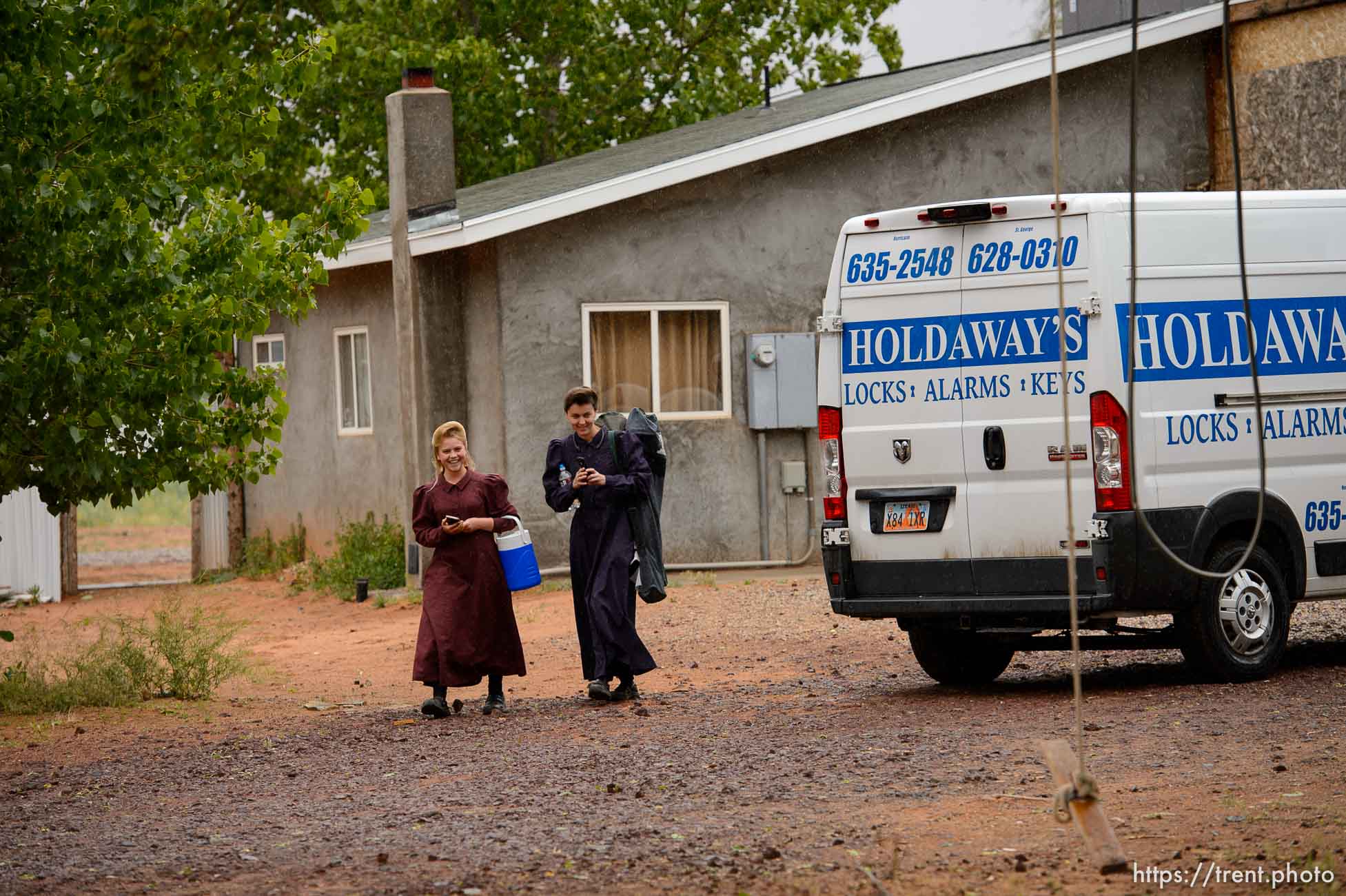 Trent Nelson  |  The Salt Lake Tribune
Two FLDS women are evicted from a home in Colorado City, AZ, Tuesday May 9, 2017, and walk off in the rain.