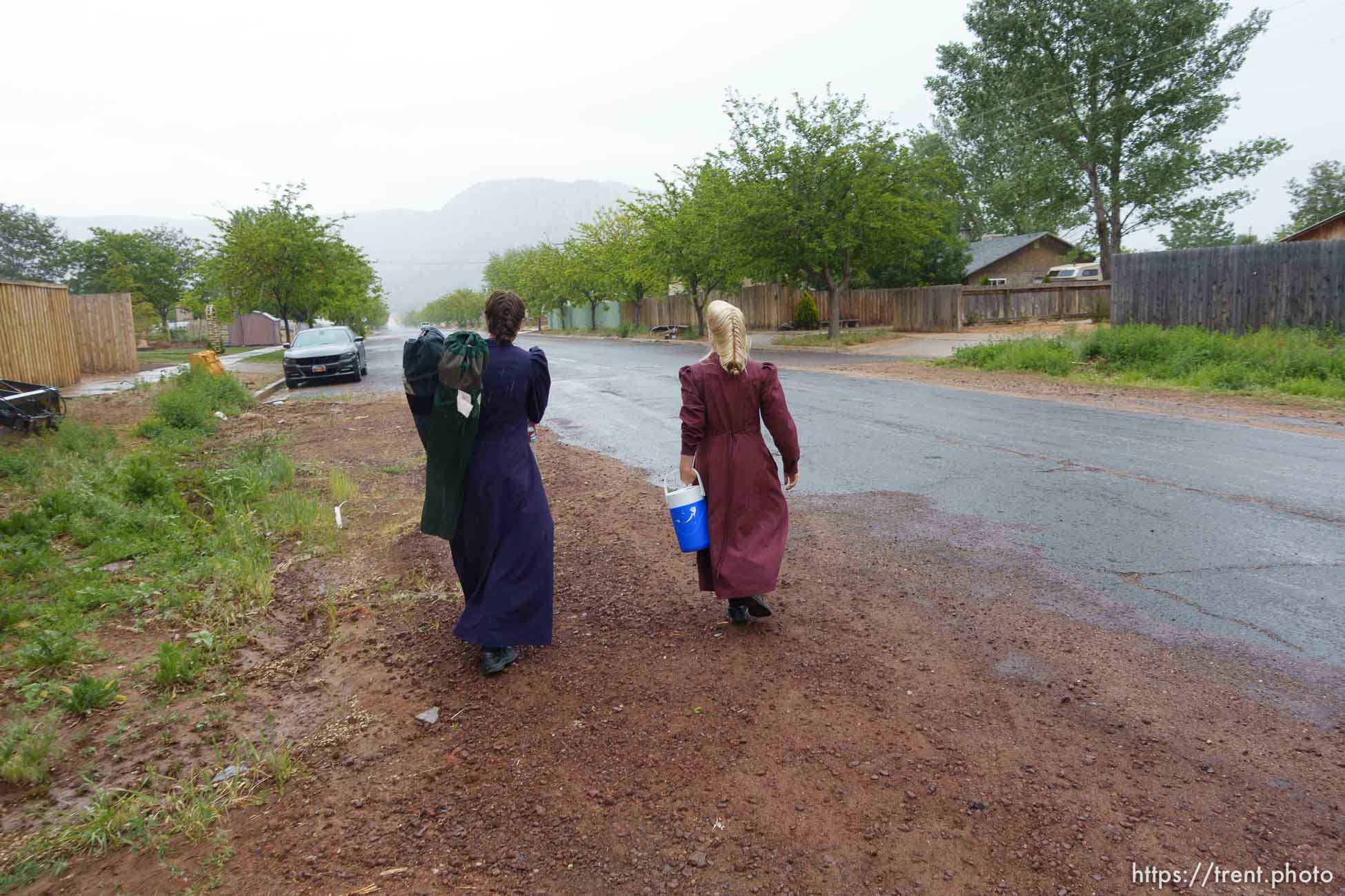 Trent Nelson  |  The Salt Lake Tribune
Two FLDS women are evicted from a home in Colorado City, AZ, Tuesday May 9, 2017, and walk off in the rain.