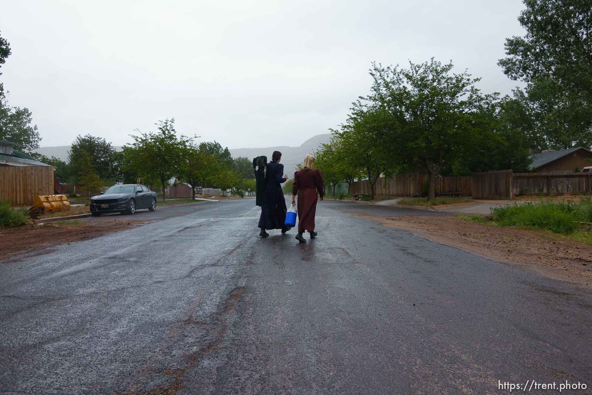 Trent Nelson  |  The Salt Lake Tribune
Two FLDS women are evicted from a home in Colorado City, AZ, Tuesday May 9, 2017, and walk off in the rain.