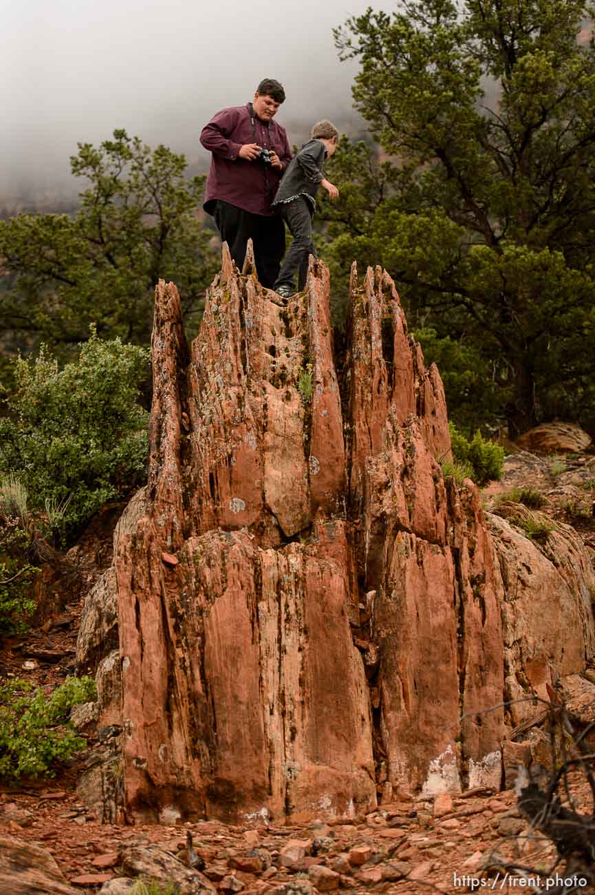 Trent Nelson  |  The Salt Lake Tribune
FLDS children watch from the top of a rock as the UEP Trust changes the locks on a Colorado City, AZ, home, Wednesday May 10, 2017.