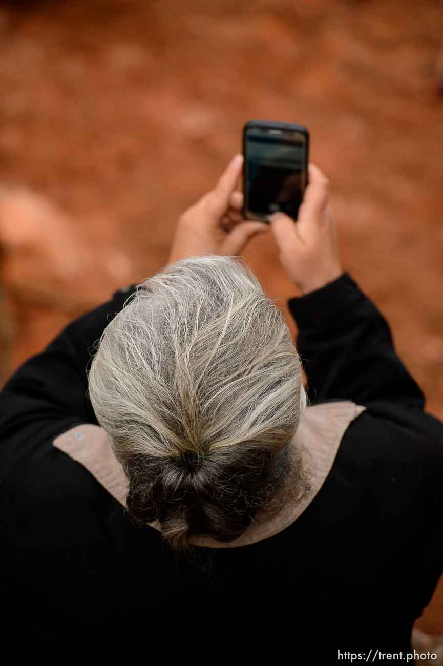 Trent Nelson  |  The Salt Lake Tribune
An FLDS woman films the UEP eviction of property at 560 E Johnson Ave, Colorado City, AZ, Wednesday May 10, 2017.