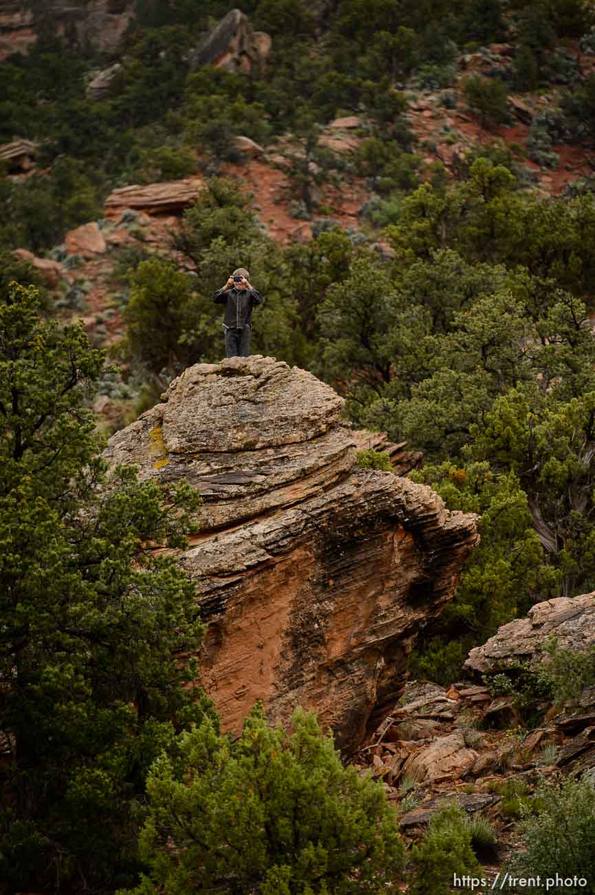 Trent Nelson  |  The Salt Lake Tribune
FLDS boy photographs from the top of a rock as the UEP changes the locks on the home at 560 E Johnson Ave, Colorado City, AZ, Wednesday May 10, 2017.