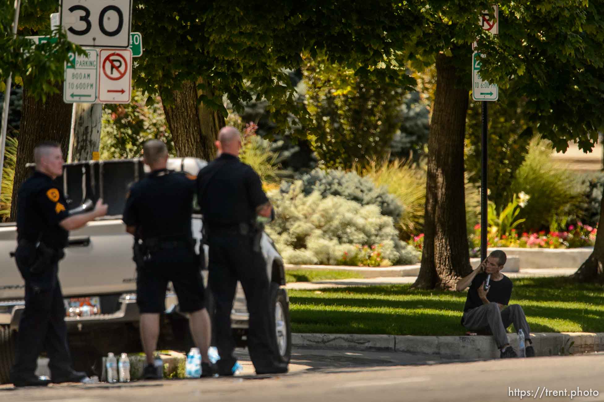 (Trent Nelson | The Salt Lake Tribune)  A young man holds a gun to his head during a standoff with police in Salt Lake City, Friday September 1, 2017.