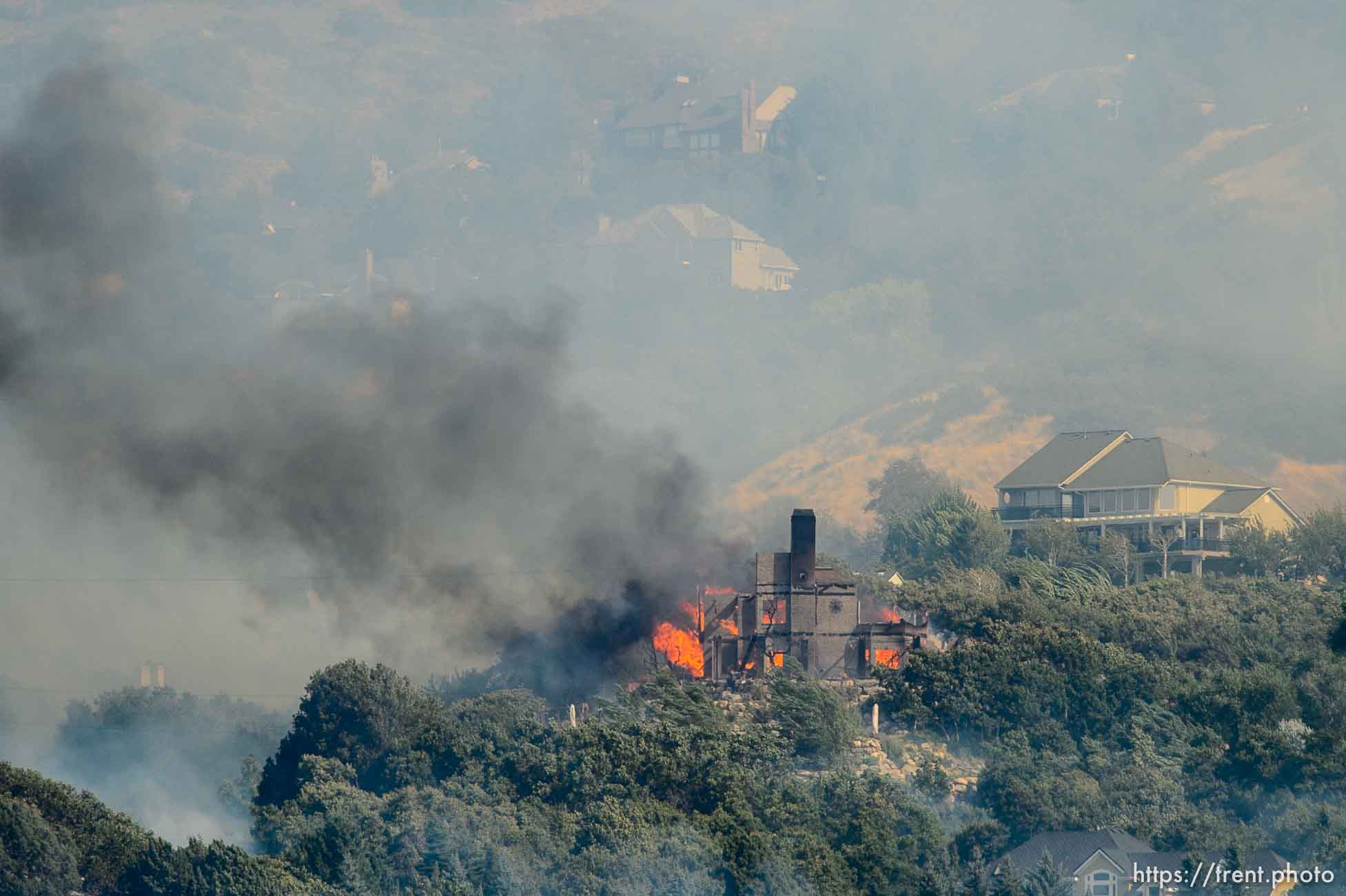 (Trent Nelson | The Salt Lake Tribune)  A home burns in at the mouth of Weber Canyon, Tuesday September 5, 2017.