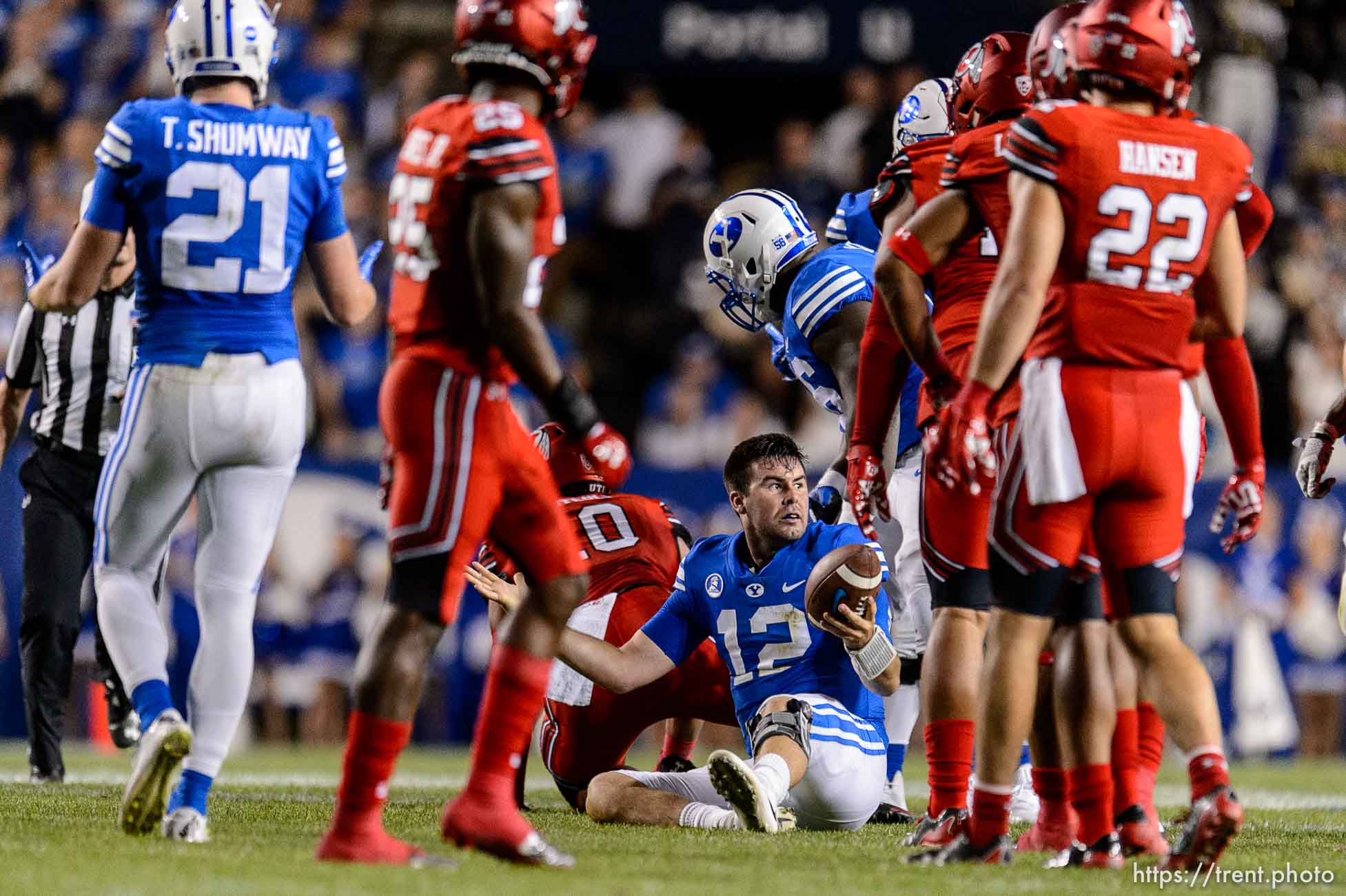 (Trent Nelson | The Salt Lake Tribune)  Brigham Young Cougars quarterback Tanner Mangum (12) looks for a call and gets it after he's apparently hit while sliding, as BYU hosts Utah, NCAA football in Provo, Saturday September 9, 2017.