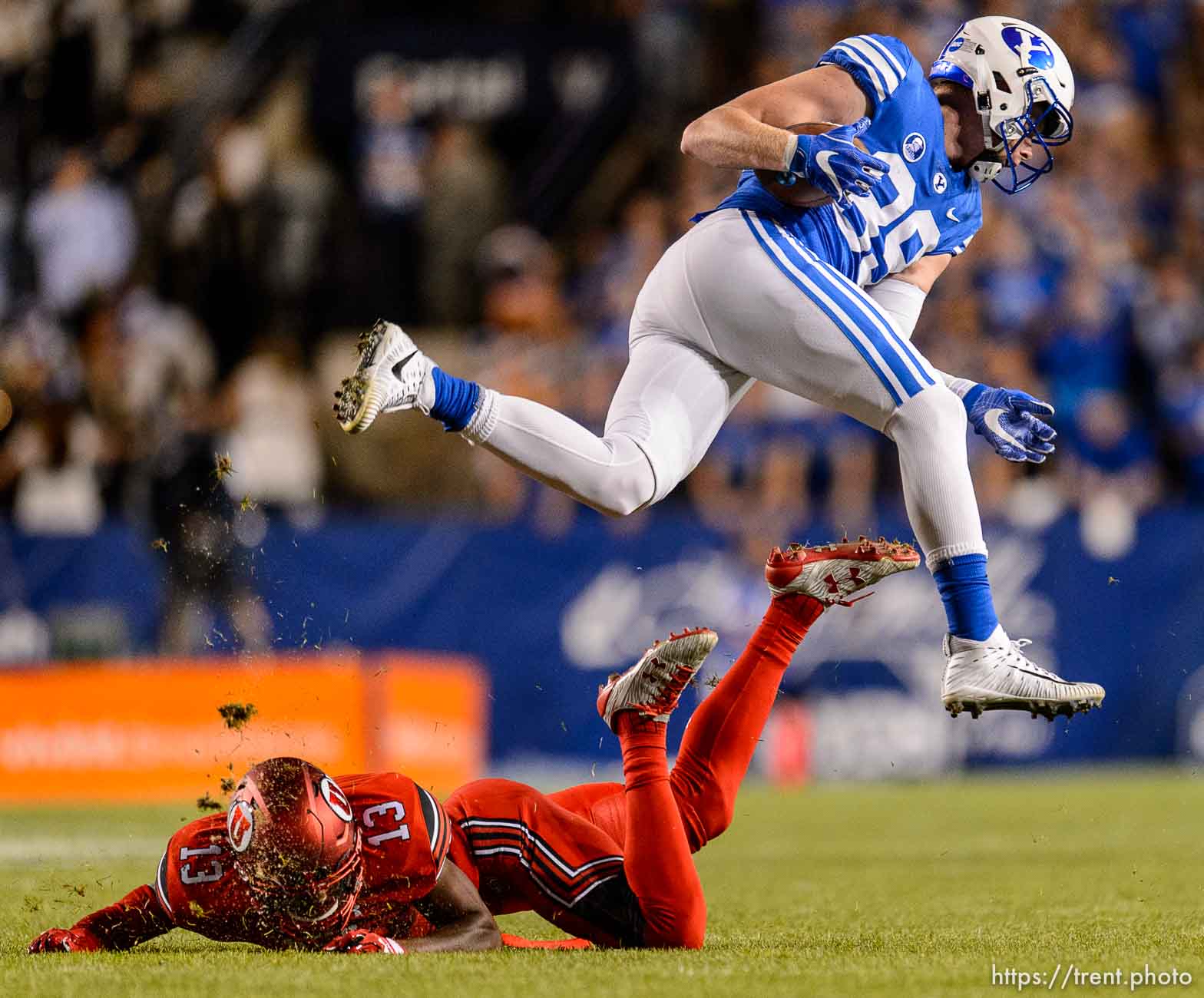 (Trent Nelson | The Salt Lake Tribune)  Brigham Young Cougars tight end Matt Bushman (89) leaps over Utah Utes defensive back Marquise Blair (13) as BYU hosts Utah, NCAA football in Provo, Saturday September 9, 2017.