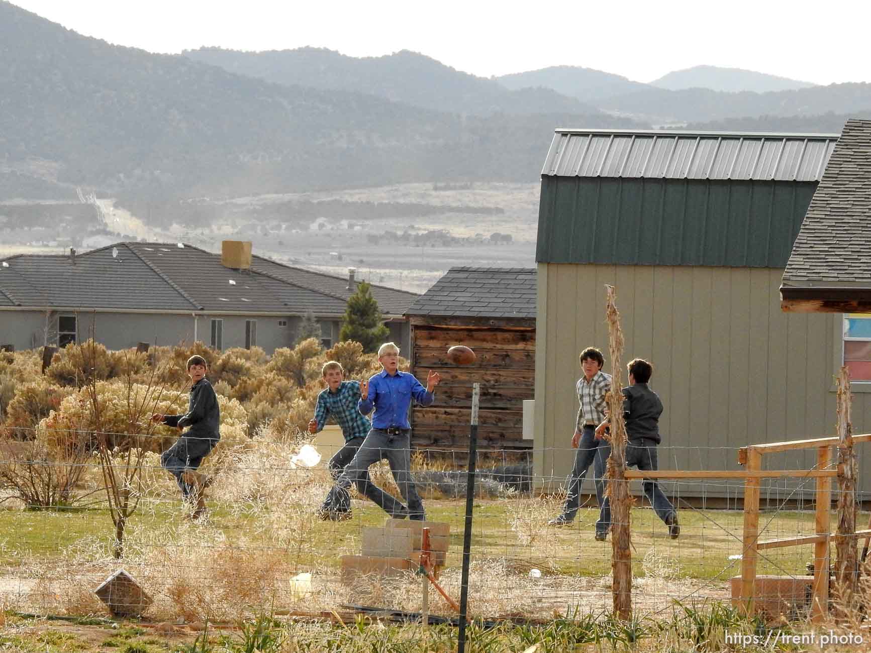 (Trent Nelson | The Salt Lake Tribune)  A group of boys play backyard football at a Cedar City home where members of the FLDS are purported to live, Wednesday November 8, 2017.