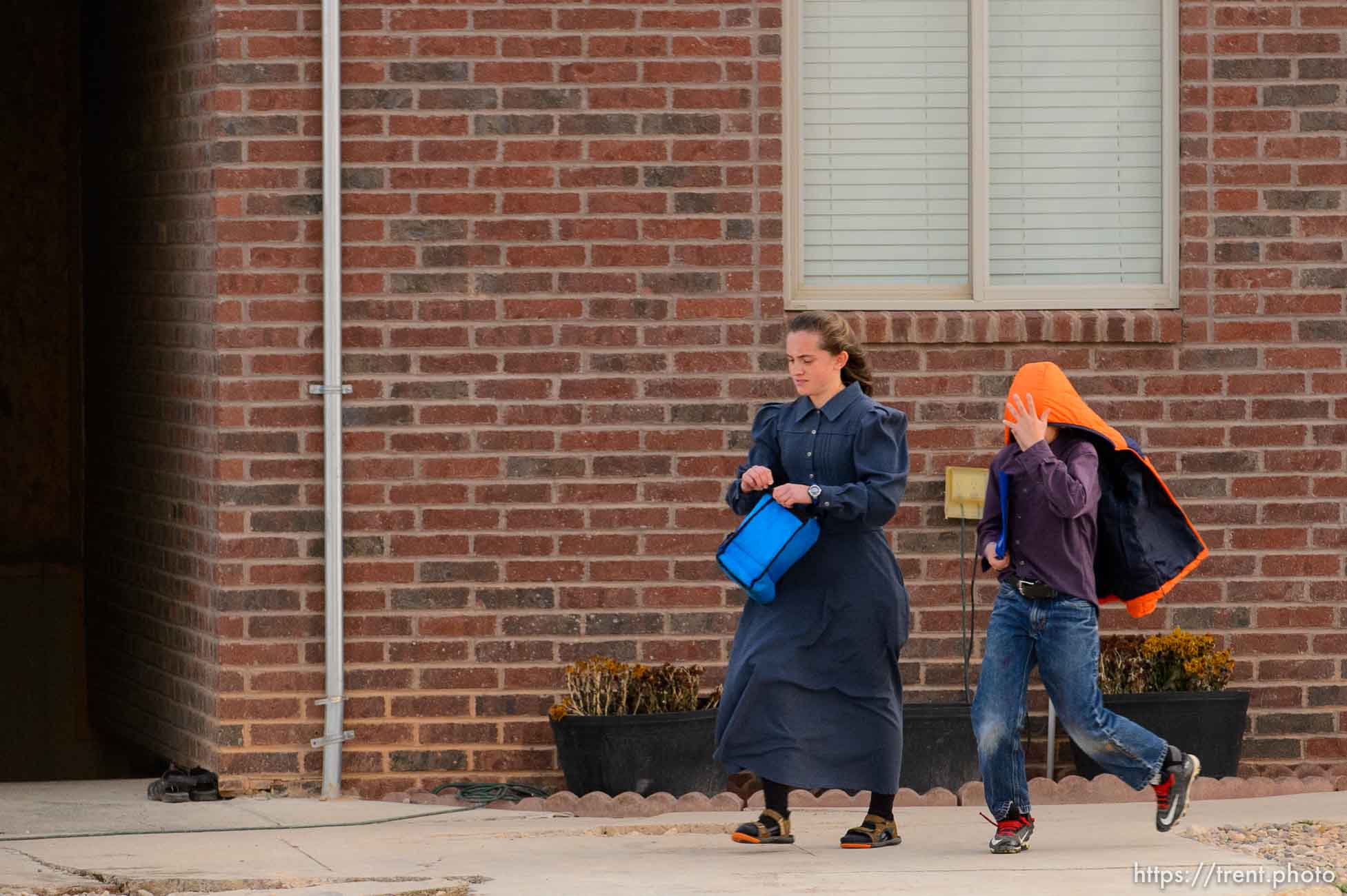 (Trent Nelson | The Salt Lake Tribune) A young woman and boy at a Cedar City home where members of the polygamous Fundamentalist Church of Jesus Christ of Latter-Day Saints are purported to live, Wednesday November 8, 2017.