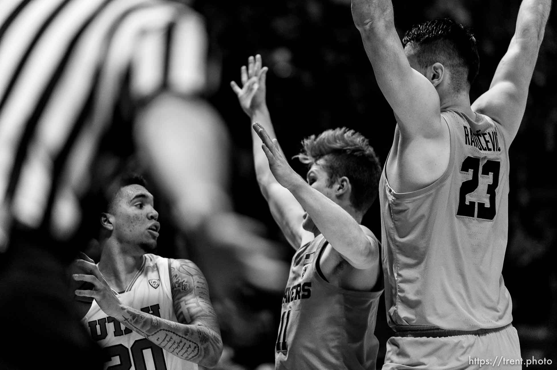 (Trent Nelson | The Salt Lake Tribune)  
Utah Utes forward Timmy Allen (20) looks to pass, defended by Oregon State Beavers guard Zach Reichle (11) and Oregon State Beavers center Gligorije Rakocevic (23) as Utah hosts Oregon State, NCAA basketball in Salt Lake City on Saturday Feb. 2, 2019.