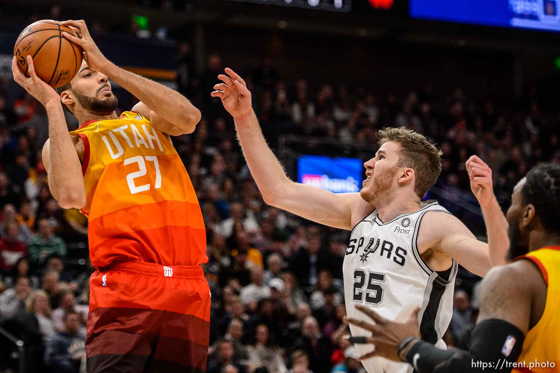 (Trent Nelson | The Salt Lake Tribune)  
Utah Jazz center Rudy Gobert (27) rebounds ahead of San Antonio Spurs center Jakob Poeltl (25) as the Utah Jazz host the San Antonio Spurs, NBA basketball in Salt Lake City on Saturday Feb. 9, 2019.