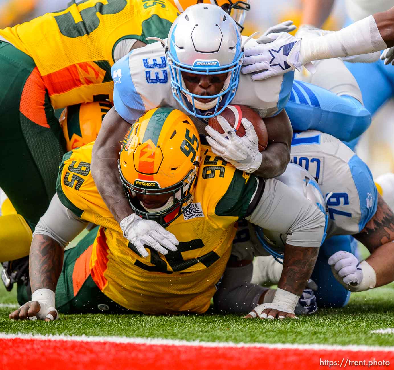 (Trent Nelson | The Salt Lake Tribune)  
Salt Lake's Branden Oliver (33) tries to go over Arizona's Trenton Thompson (95), but comes up short as the Salt Lake Stallions host the Arizona Hotshots, Alliance of American Football in Salt Lake City on Saturday Feb. 23, 2019.